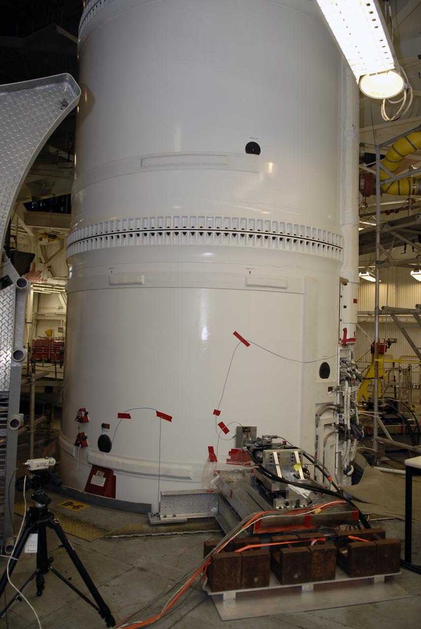 CAPE CANAVERAL, Fla. – In the Vehicle Assembly Building's High Bay 4 at NASA's Kennedy Space Center in Florida, wires are taped to the Ares I-X launch vehicle for the sway test being conducted. The test is simulating conditions the rocket could experience during rollout to Launch Pad 39B, wind conditions at the pad and first-stage ignition. During the test, vibrations are mechanically induced into the rocket by four hydraulic shakers and a sway is manually introduced for lateral motion to measure the vehicle's response. A total of 44 accelerometers are installed on the flight test vehicle that required more than 27,000 feet of cable. Part of the Constellation Program, the Ares I-X is the test vehicle for the Ares I, which is the essential core of a space transportation system that eventually will carry crewed missions back to the moon, on to Mars and out into the solar system . The Ares I-X flight test is targeted for Oct. 31. Photo credit: NASA/Kim Shiflett