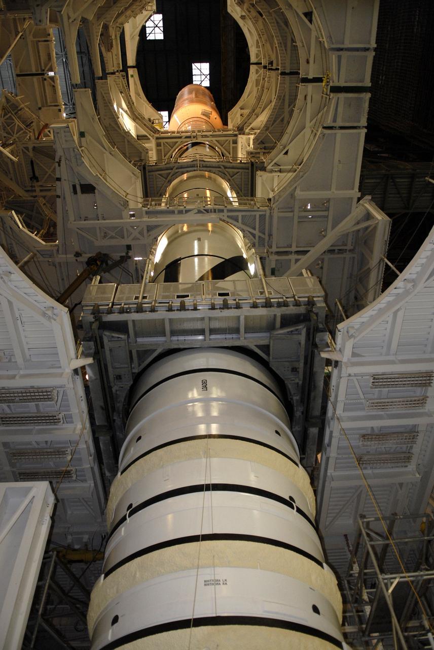 CAPE CANAVERAL, Fla. – Work platforms surround the Ares I-X launch vehicle in the Vehicle Assembly Building's High Bay 4 at NASA's Kennedy Space Center in Florida. The rocket has undergone a sway test that simulated conditions the rocket could experience during rollout to Launch Pad 39B, wind conditions at the pad and first-stage ignition. During the test, vibrations are mechanically induced into the rocket by four hydraulic shakers and a sway is manually introduced for lateral motion to measure the vehicle's response. A total of 44 accelerometers are installed on the flight test vehicle that required more than 27,000 feet of cable. Part of the Constellation Program, the Ares I-X is the test vehicle for the Ares I, which is the essential core of a space transportation system that eventually will carry crewed missions back to the moon, on to Mars and out into the solar system . The Ares I-X flight test is targeted for Oct. 31. Photo credit: NASA/Kim Shiflett