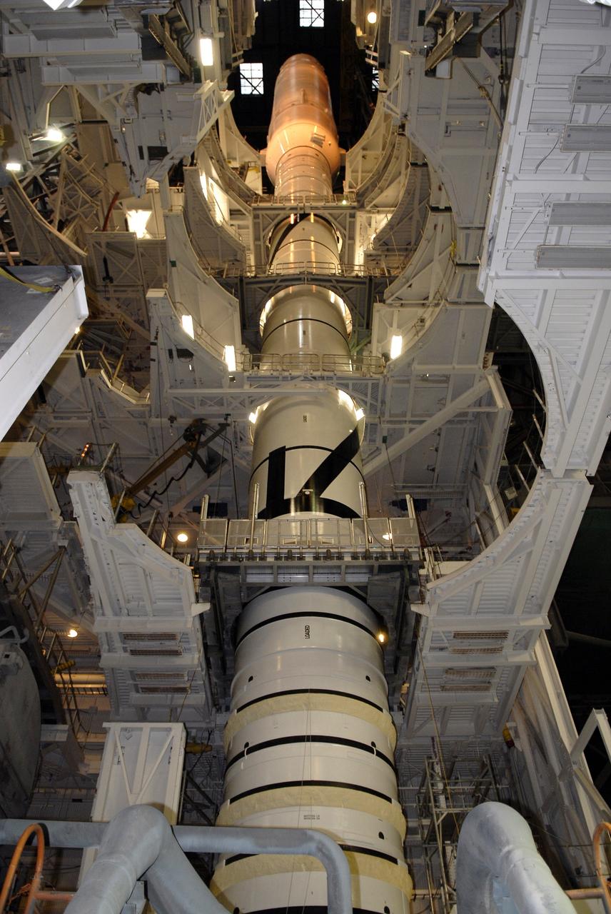 CAPE CANAVERAL, Fla. – Work platforms surround the Ares I-X launch vehicle in the Vehicle Assembly Building's High Bay 4 at NASA's Kennedy Space Center in Florida. The rocket has undergone a sway test that simulated conditions the rocket could experience during rollout to Launch Pad 39B, wind conditions at the pad and first-stage ignition. During the test, vibrations are mechanically induced into the rocket by four hydraulic shakers and a sway is manually introduced for lateral motion to measure the vehicle's response. A total of 44 accelerometers are installed on the flight test vehicle that required more than 27,000 feet of cable. Part of the Constellation Program, the Ares I-X is the test vehicle for the Ares I, which is the essential core of a space transportation system that eventually will carry crewed missions back to the moon, on to Mars and out into the solar system . The Ares I-X flight test is targeted for Oct. 31. Photo credit: NASA/Kim Shiflett