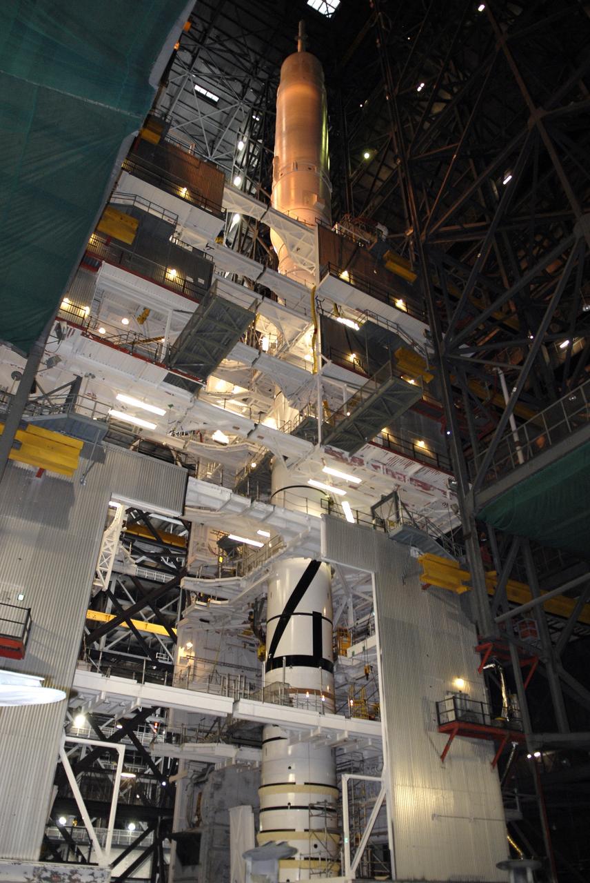 CAPE CANAVERAL, Fla. – Work platforms surround the Ares I-X launch vehicle in the Vehicle Assembly Building's High Bay 4 at NASA's Kennedy Space Center in Florida. The rocket has undergone a sway test that simulated conditions the rocket could experience during rollout to Launch Pad 39B, wind conditions at the pad and first-stage ignition. During the test, vibrations are mechanically induced into the rocket by four hydraulic shakers and a sway is manually introduced for lateral motion to measure the vehicle's response. A total of 44 accelerometers are installed on the flight test vehicle that required more than 27,000 feet of cable. Part of the Constellation Program, the Ares I-X is the test vehicle for the Ares I, which is the essential core of a space transportation system that eventually will carry crewed missions back to the moon, on to Mars and out into the solar system . The Ares I-X flight test is targeted for Oct. 31. Photo credit: NASA/Kim Shiflett