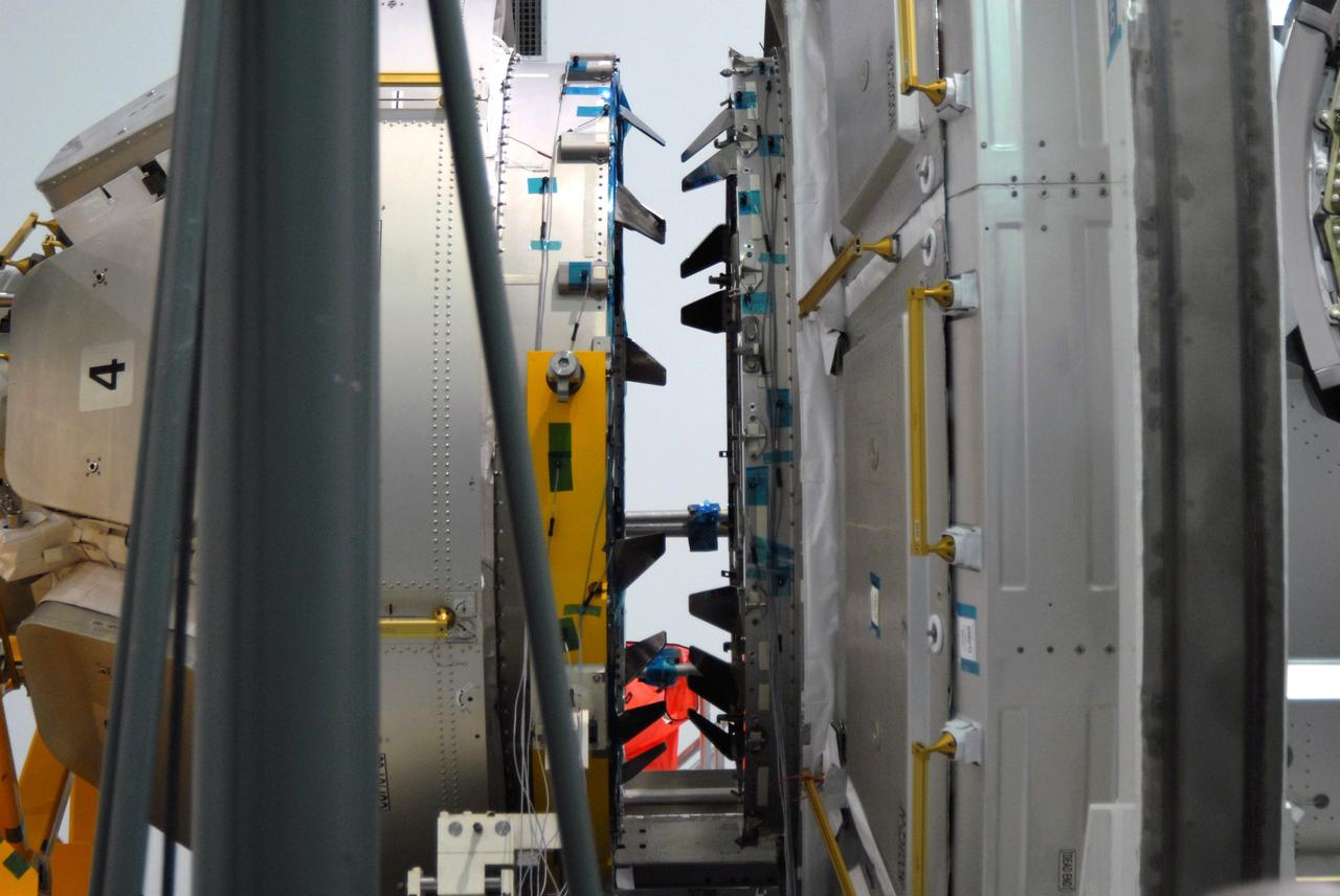 CAPE CANAVERAL, Fla. – In the Space Station Processing Facility at NASA's Kennedy Space Center in Florida, NASA's Cupola module, at left, aligns with the Tranquility module, at right. Cupola and Tranquility are the payload for space shuttle Endeavour's STS-130 mission to the International Space Station. The module was built for the European Space Agency by Alenia Spazio in Turin, Italy. When attached to the Tranquility Node 3 module, Cupola will resemble a circular bay window that will provide a vastly improved view of the station's exterior. Just under 10 feet in diameter, the module will accommodate two crew members and portable workstations that can control station and robotic activities. The multi-directional view will allow the crew to monitor spacewalks and docking operations, as well as provide a spectacular view of Earth and other celestial objects. Endeavour is targeted to launch Feb. 4, 2010. Photo credit: NASA/Jim Grossmann