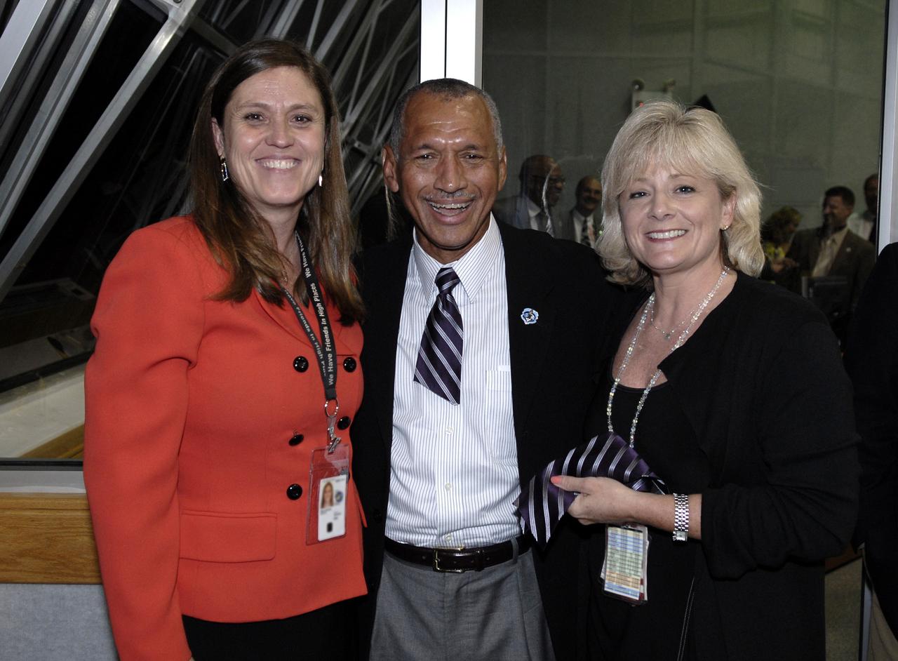 CAPE CANAVERAL, Fla. – -- In NASA Kennedy Space Center's Firing Room 4, NASA Administrator Charles Bolden has had his tie cut, a ritual for first-timers at a launch.  At left is Rita Willcoxon, director of Launch Vehicle Processing at Kennedy; at right is Jody Singer, deputy manager of the Shuttle Propulsion Office at NASA's Marshall Space Flight Center in Huntsville. Bolden is at Kennedy for the launch of space shuttle Discovery on the STS-128 mission. Liftoff from Launch Pad 39A was on time at 11:59 p.m. EDT. The first launch attempt on Aug. 24 was postponed due to unfavorable weather conditions.  The second attempt on Aug. 25 also was postponed due to an issue with a valve in space shuttle Discovery's main propulsion system.  The STS-128 mission is the 30th International Space Station assembly flight and the 128th space shuttle flight. The 13-day mission will deliver more than 7 tons of supplies, science racks and equipment, as well as additional environmental hardware to sustain six crew members on the International Space Station. The equipment includes a freezer to store research samples, a new sleeping compartment and the COLBERT treadmill. Photo credit:  NASA/Kim Shiflett