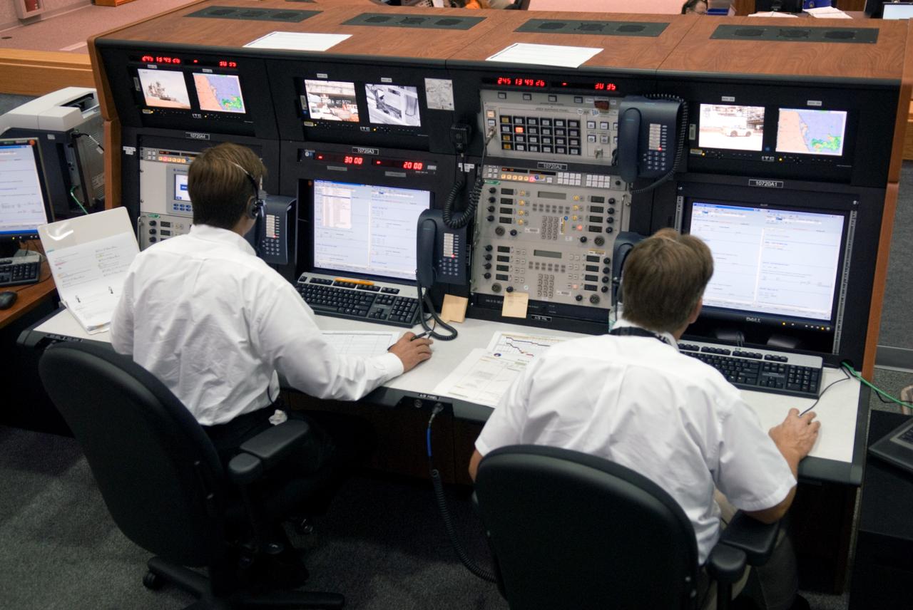 CAPE CANAVERAL, Fla. – In Firing Room 1 at NASA's Kennedy Space Center in Florida, Bob Holl and Jeff Spaulding take part in a countdown simulation for the upcoming Ares I-X flight test.  Ares I-X is targeted for the  test on Oct. 31.  Photo credit: NASA/Kim Shiflett