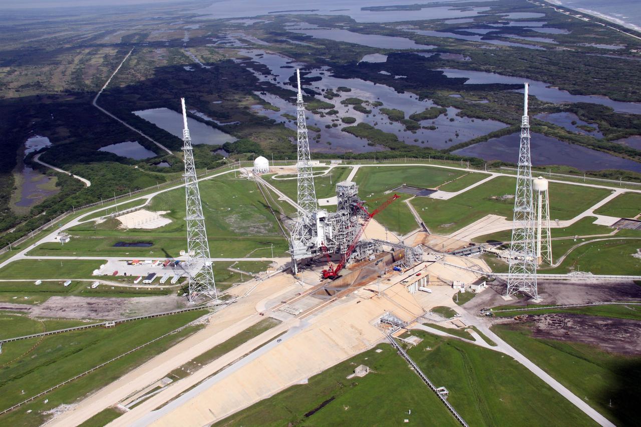 CAPE CANAVERAL, Fla. – An aerial view of NASA Kennedy Space Center's Launch Pad 39B. The pad is surrounded by lightning towers erected for NASA's Constellation Program, which will use the pad for Ares rocket launches. Photo credit: NASA/Troy Cryder