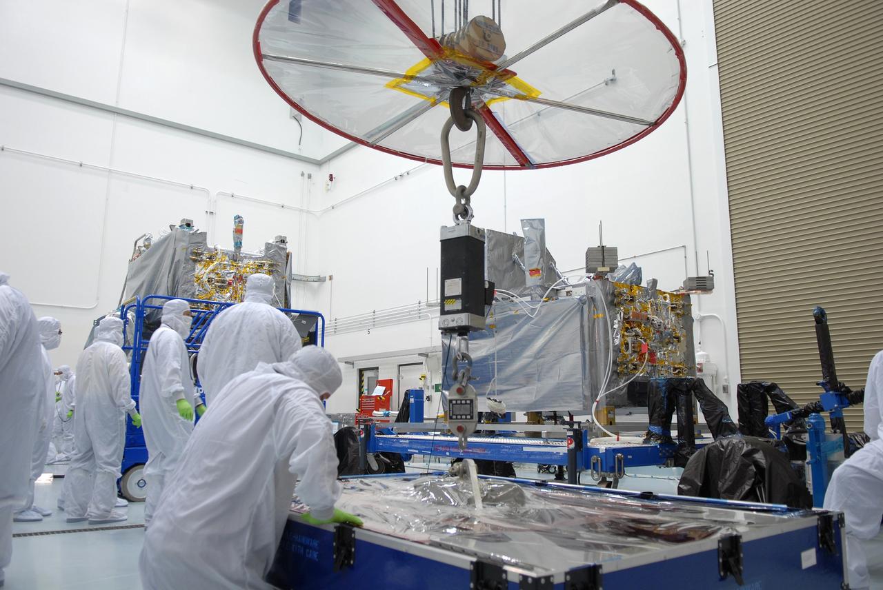 CAPE CANAVERAL, Fla. – At the Astrotech payload processing facility in Titusville, Fla., workers prepare to lift the SV1 and mate it to the SV2 spacecraft for the Space Tracking and Surveillance System – Demonstrators, or STSS Demo, Program.  STSS-Demo is a space-based sensor component of a layered Ballistic Missile Defense System designed for the overall mission of detecting, tracking and discriminating ballistic missiles.  The spacecraft is capable of tracking objects after boost phase and provides trajectory information to other sensors. It will be launched by NASA for the Missile Defense Agency between 8 and 8:58 a.m. EDT Sept. 18.  Approved for Public Release 09-MDA-04886 (10 SEPT 09) Photo credit: NASA/Jim Grossmann