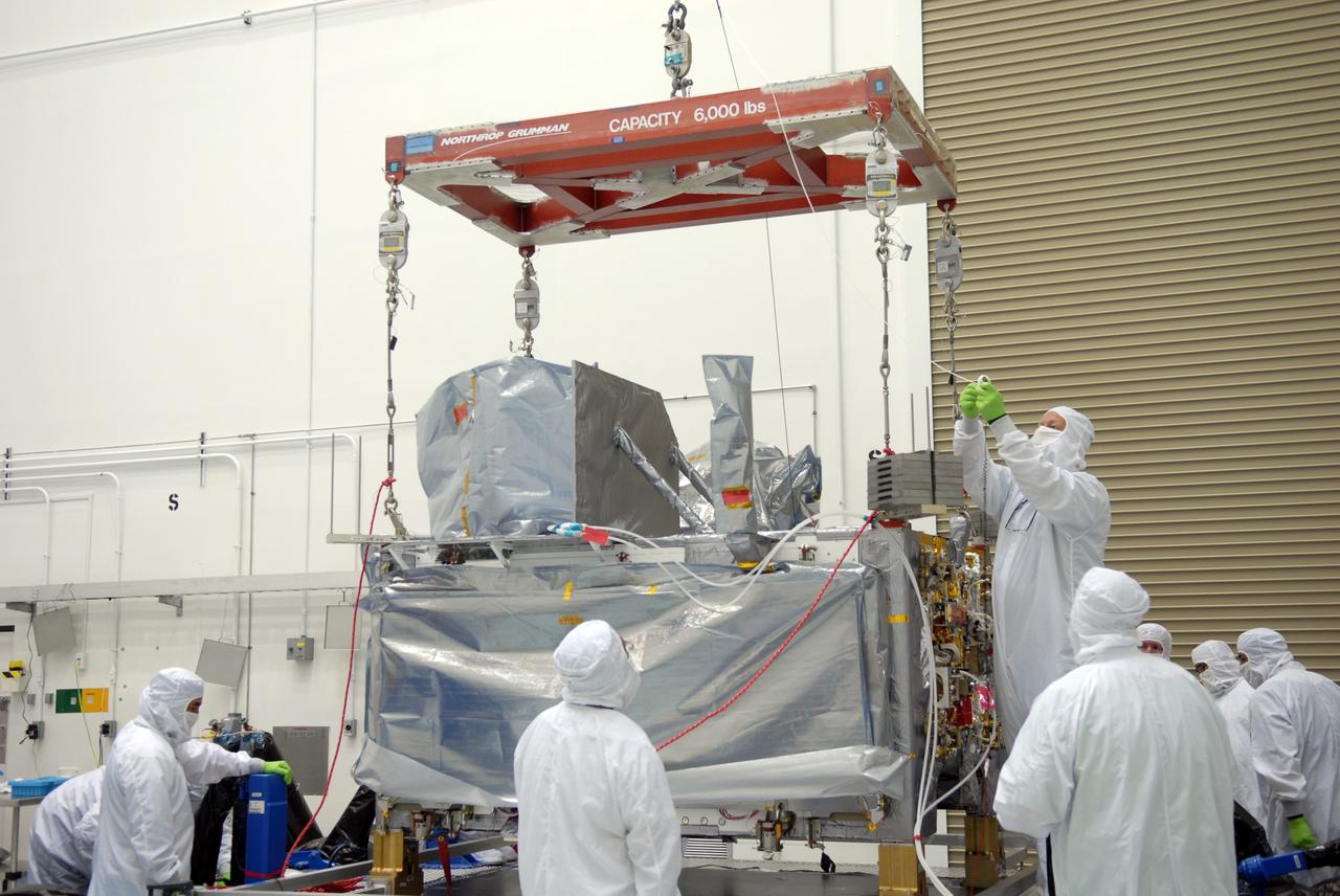 CAPE CANAVERAL, Fla. – At the Astrotech payload processing facility in Titusville, Fla., a crane is attached to the SV1 spacecraft, part of the Space Tracking and Surveillance System – Demonstrators, or STSS Demo, Program.  The SV1 will be lifted and moved to mate with the SV2 on another stand nearby. STSS-Demo is a space-based sensor component of a layered Ballistic Missile Defense System designed for the overall mission of detecting, tracking and discriminating ballistic missiles.  The spacecraft is capable of tracking objects after boost phase and provides trajectory information to other sensors. It will be launched by NASA for the Missile Defense Agency between 8 and 8:58 a.m. EDT Sept. 18.  Approved for Public Release 09-MDA-04886 (10 SEPT 09) Photo credit: NASA/Jim Grossmann