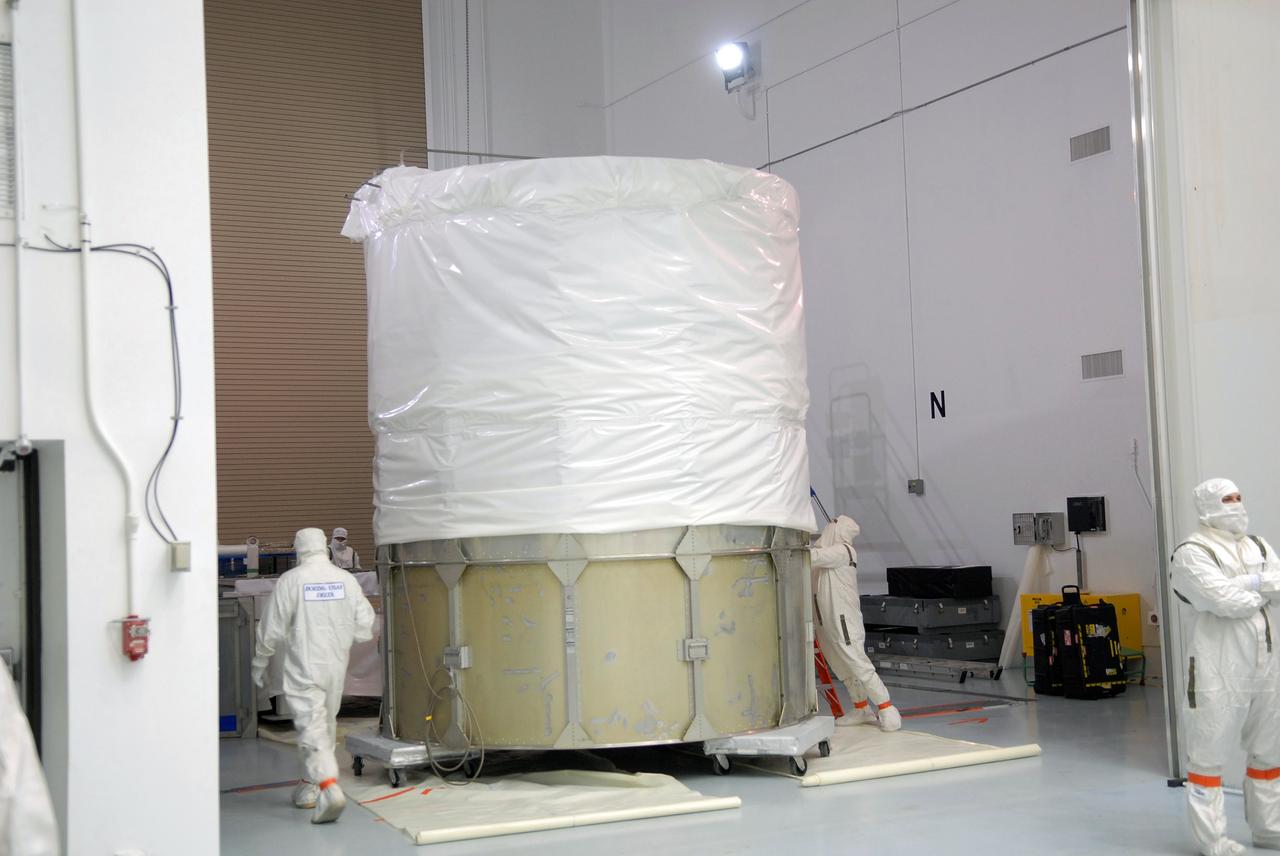 CAPE CANAVERAL, Fla. –  At the Astrotech payload processing facility in Titusville, Fla., a canister and protective cover are being prepared for placement around the SV1-SV2 spacecraft.  The two spacecraft are known as the Space Tracking and Surveillance System – Demonstrators, or STSS Demo, which is a space-based sensor component of a layered Ballistic Missile Defense System designed for the overall mission of detecting, tracking and discriminating ballistic missiles.  STSS is capable of tracking objects after boost phase and provides trajectory information to other sensors. It will be launched by NASA for the Missile Defense Agency between 8 and 8:58 a.m. EDT Sept. 18.  Approved for Public Release 09-MDA-04886 (10 SEPT 09) Photo credit: NASA/Jim Grossmann