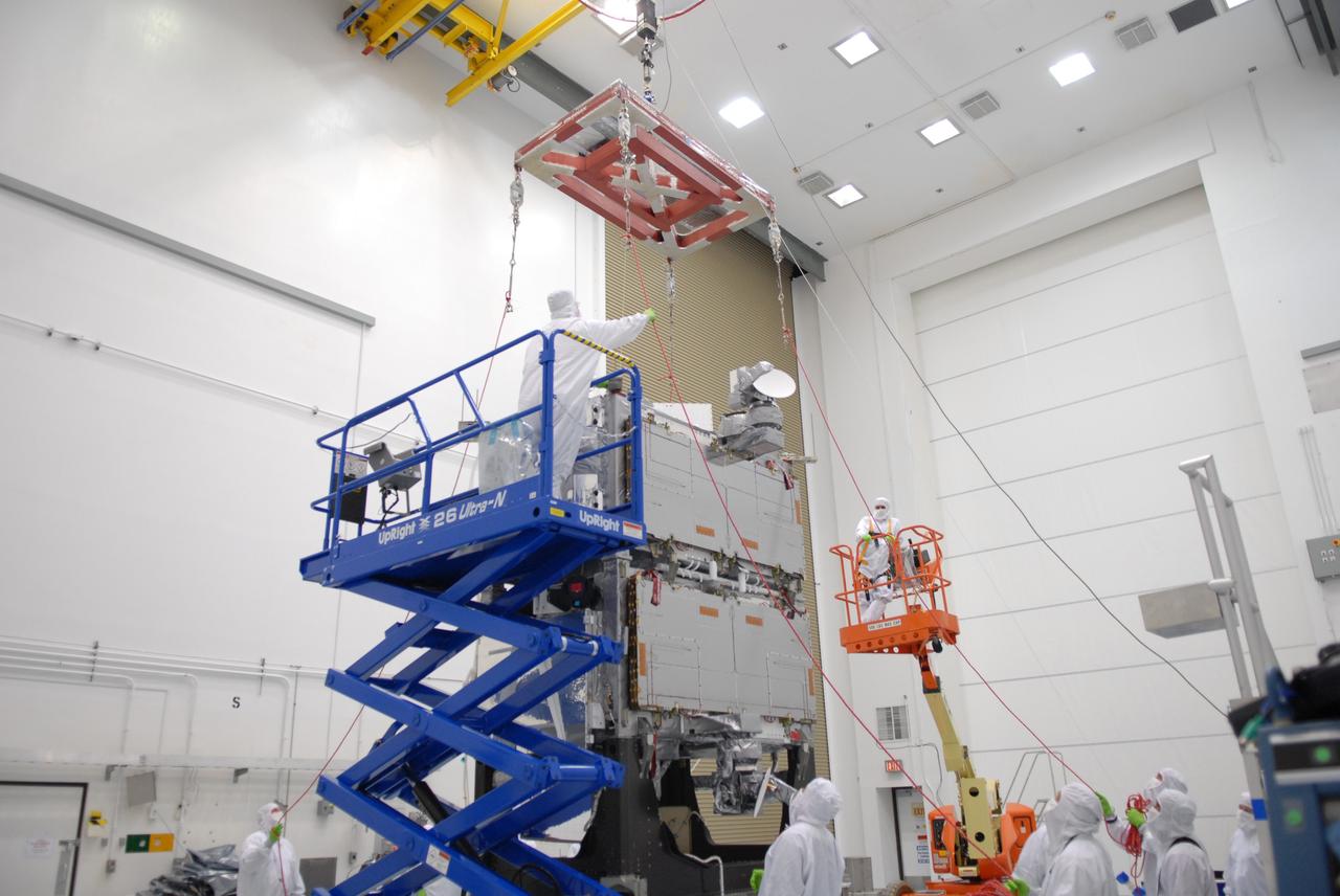 CAPE CANAVERAL, Fla. –  At the Astrotech payload processing facility in Titusville, Fla., an overhead crane with a scale is being attached to the SV1-SV2 spacecraft, which will be weighed.  The two spacecraft are known as the Space Tracking and Surveillance System – Demonstrators, or STSS Demo, which is a space-based sensor component of a layered Ballistic Missile Defense System designed for the overall mission of detecting, tracking and discriminating ballistic missiles.  STSS is capable of tracking objects after boost phase and provides trajectory information to other sensors. It will be launched by NASA for the Missile Defense Agency between 8 and 8:58 a.m. EDT Sept. 18.  Approved for Public Release 09-MDA-04886 (10 SEPT 09) Photo credit: NASA/Jim Grossmann