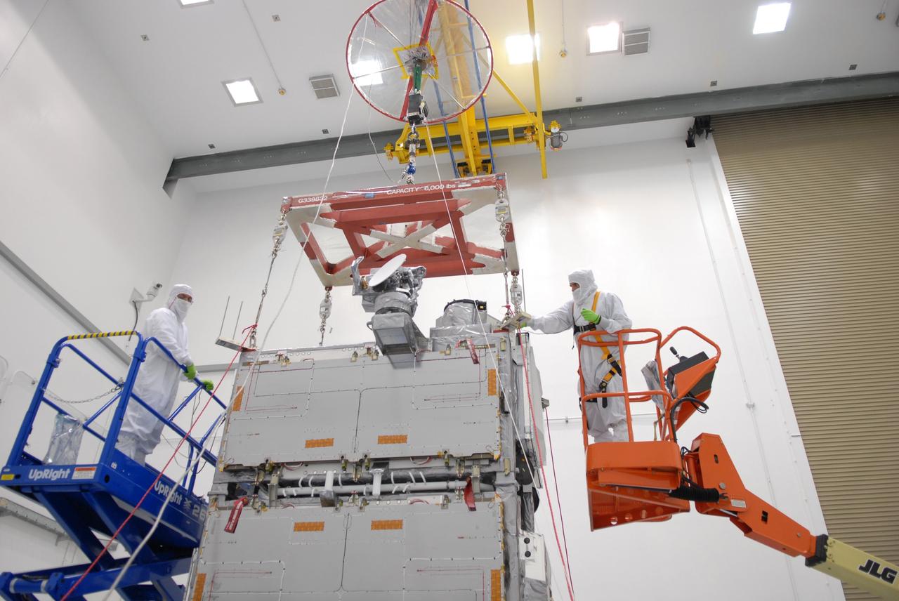 CAPE CANAVERAL, Fla. –  At the Astrotech payload processing facility in Titusville, Fla., an overhead crane with a scale is being attached to the SV1-SV2 spacecraft, which will be weighed. The two spacecraft are known as the Space Tracking and Surveillance System – Demonstrators, or STSS Demo, which is a space-based sensor component of a layered Ballistic Missile Defense System designed for the overall mission of detecting, tracking and discriminating ballistic missiles.  STSS is capable of tracking objects after boost phase and provides trajectory information to other sensors. It will be launched by NASA for the Missile Defense Agency between 8 and 8:58 a.m. EDT Sept. 18.  Approved for Public Release 09-MDA-04886 (10 SEPT 09) Photo credit: NASA/Jim Grossmann