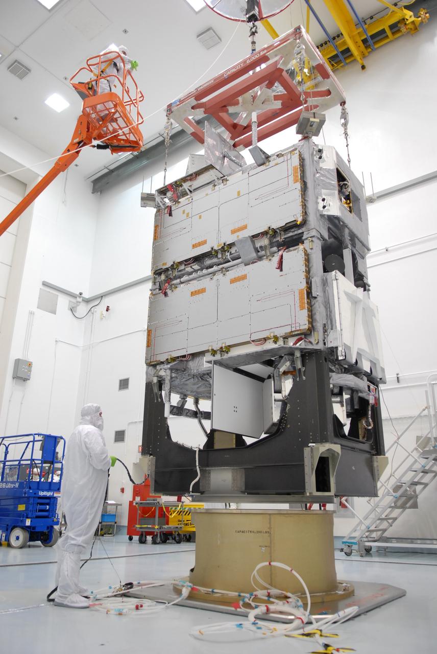 CAPE CANAVERAL, Fla. – At the Astrotech payload processing facility in Titusville, Fla., the SV1-SV2 spacecraft is lifted for weighing.  The two spacecraft are known as the Space Tracking and Surveillance System – Demonstrators, or STSS Demo, which is a space-based sensor component of a layered Ballistic Missile Defense System designed for the overall mission of detecting, tracking and discriminating ballistic missiles.  STSS is capable of tracking objects after boost phase and provides trajectory information to other sensors. It will be launched by NASA for the Missile Defense Agency between 8 and 8:58 a.m. EDT Sept. 18.  Approved for Public Release 09-MDA-04886 (10 SEPT 09) Photo credit: NASA/Jim Grossmann