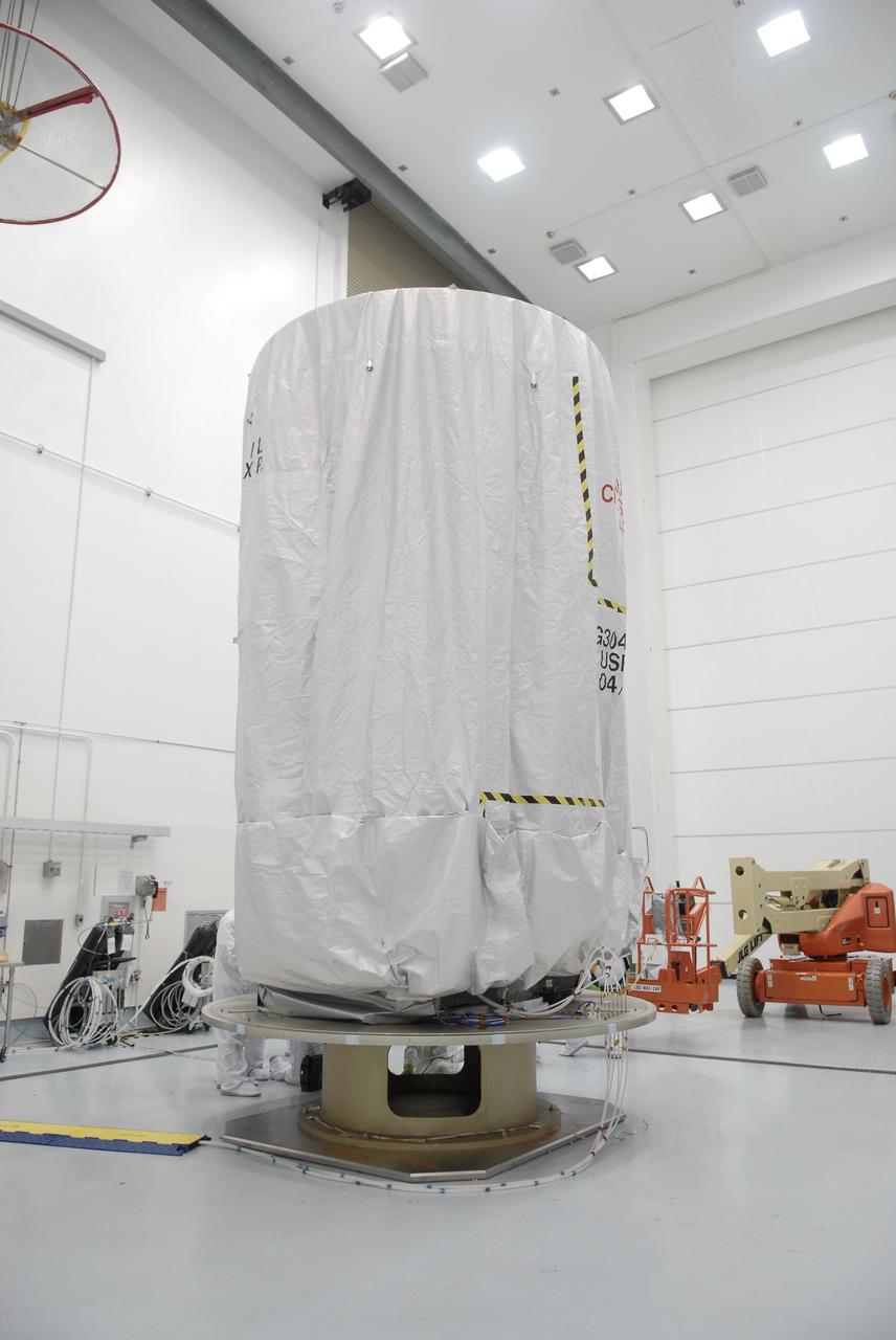 CAPE CANAVERAL, Fla. – At the Astrotech payload processing facility in Titusville, Fla., the Space Tracking and Surveillance System – Demonstrators, or STSS Demo, spacecraft is under a protective cover before being encased in the transportation canister.   The STSS Demo is a space-based sensor component of a layered Ballistic Missile Defense System designed for the overall mission of detecting, tracking and discriminating ballistic missiles.  STSS is capable of tracking objects after boost phase and provides trajectory information to other sensors. It will be launched by NASA for the Missile Defense Agency between 8 and 8:58 a.m. EDT Sept. 18.  Approved for Public Release 09-MDA-04886 (10 SEPT 09) Photo credit: NASA/Kim Shiflett