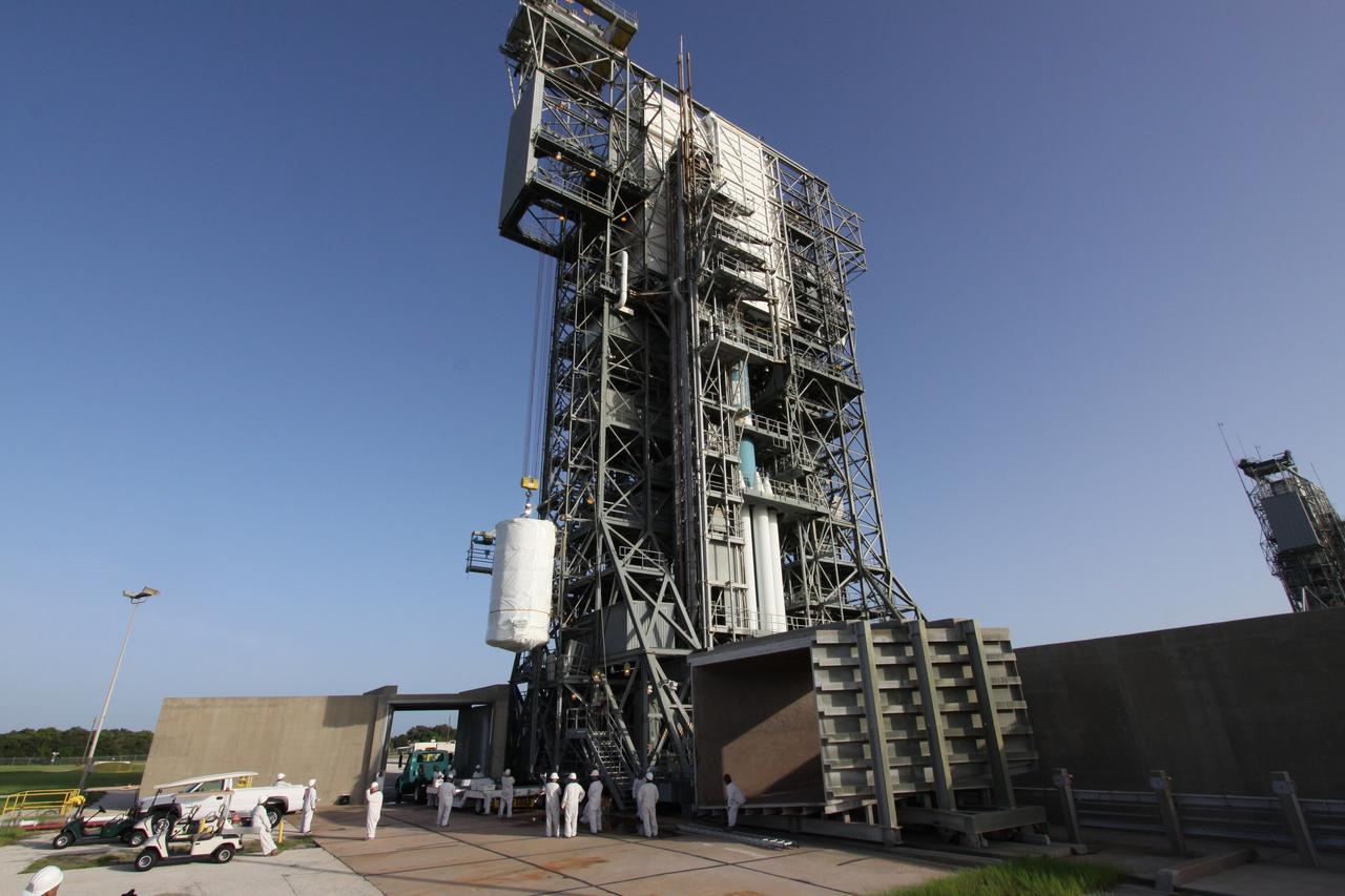 CAPE CANAVERAL, Fla. – The enclosed Space Tracking and Surveillance System – Demonstrators, or STSS-Demo, spacecraft is being lifted into the mobile service tower on Cape Canaveral Air Force Station's Launch Pad 17-B. The STSS Demo is a space-based sensor component of a layered Ballistic Missile Defense System designed for the overall mission of detecting, tracking and discriminating ballistic missiles.  STSS is capable of tracking objects after boost phase and provides trajectory information to other sensors. It will be launched by NASA for the Missile Defense Agency between 8 and 8:58 a.m. EDT Sept. 18.  Approved for Public Release 09-MDA-04886 (10 SEPT 09) Photo credit: NASA/Jack Pfaller