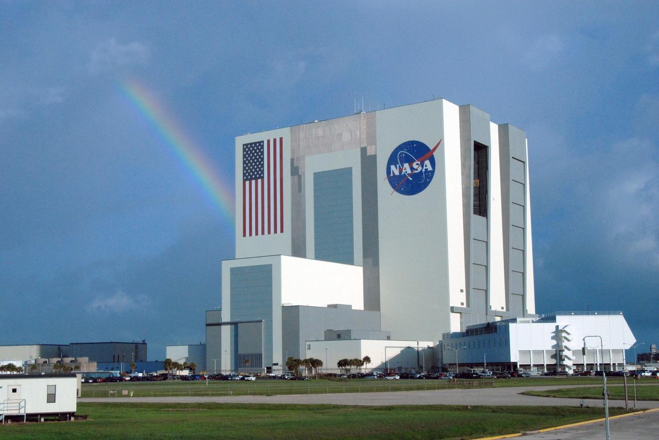 CAPE CANAVERAL, Fla. – Between rain showers over NASA's Kennedy Space Center in Florida, a rainbow breaks through the clouds behind the Vehicle Assembly Building.  Rain and thunderstorms caused the waveoff of two landing opportunities Sept. 10 for space shuttle Discovery's return to Earth from the STS-128 mission. Photo credit: NASA/Jim Grossmann