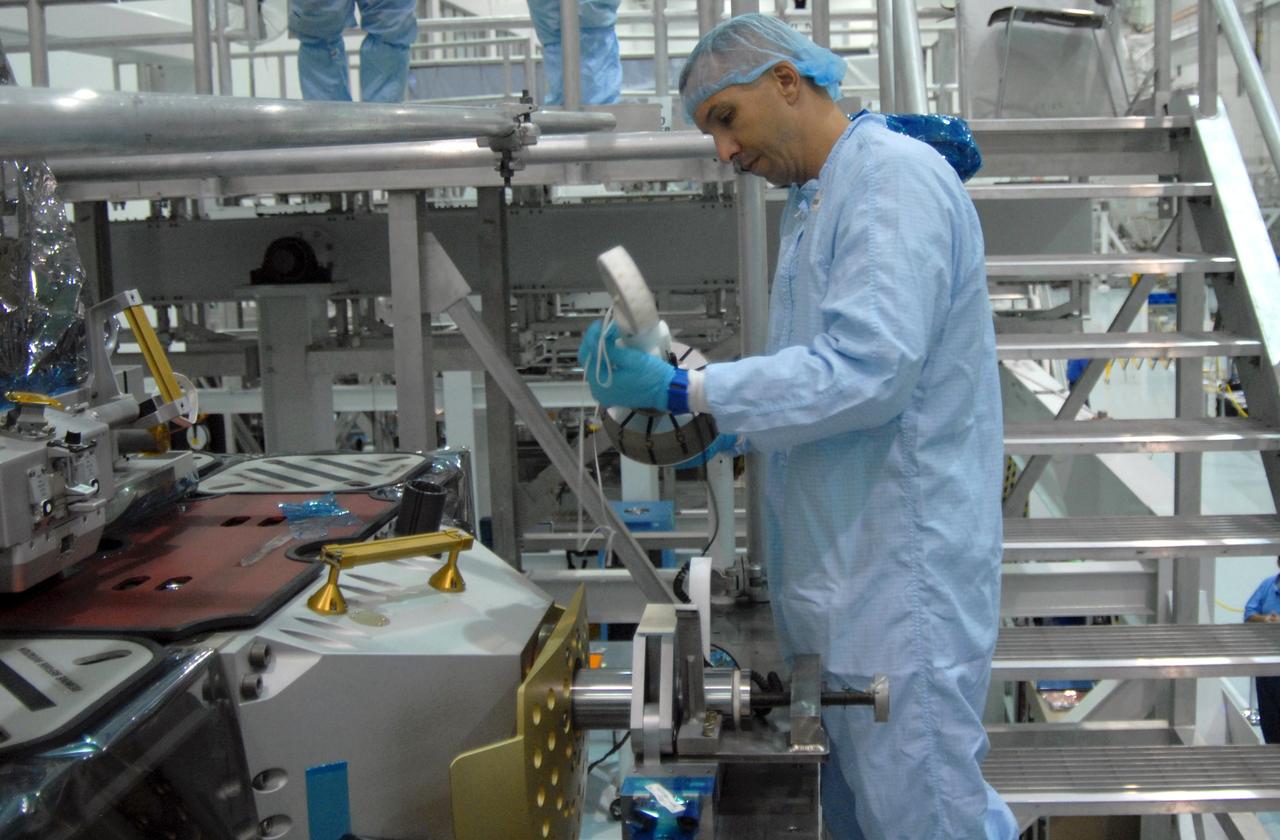 CAPE CANAVERAL, Fla. – In NASA Kennedy Space Center's Space Station Processing Facility, STS-129 Mission Specialist Randy Bresnik becomes familiar with equipment installed on the Express Logistics Carrier, or ELC.  The crew is at Kennedy for a Crew Equipment Interface Test, which provides hands-on training and observation of shuttle and flight hardware. The carrier is part of the STS-129 payload on space shuttle Atlantis, which will deliver to the International Space Station two spare gyroscopes, two nitrogen tank assemblies, two pump modules, an ammonia tank assembly and a spare latching end effector for the station's robotic arm. STS-129 is targeted to launch Nov. 12.   Photo credit: NASA/Jim Grossmann