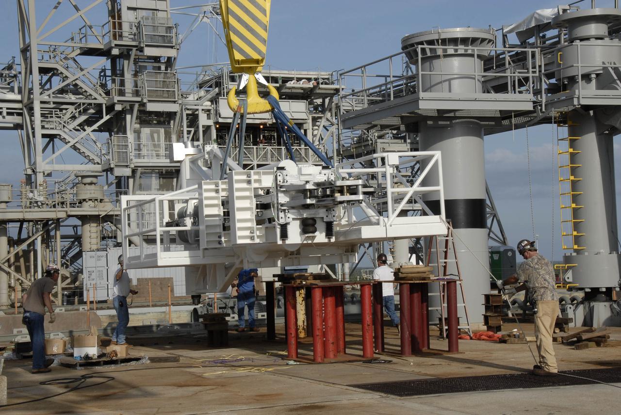 CAPE CANAVERAL, Fla. – On NASA Kennedy Space Center's Launch Pad 39B, the stabilizing arm is lifted from the pad surface. It will be attached to the fixed service structure for use in the Ares I-X rocket launch, targeted for Oct. 31. Ares I-X is part of NASA's Constellation Program. Photo credit: NASA/Kim Shiflett