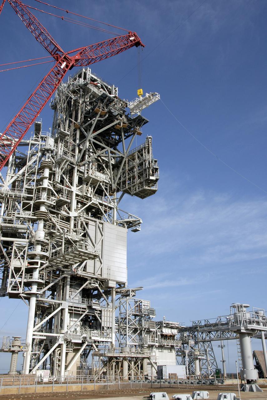 CAPE CANAVERAL, Fla. – On NASA Kennedy Space Center's Launch Pad 39B, the stabilizing arm is moved into place on the fixed service structure for attachment. The arm will be used in the Ares I-X rocket launch, targeted for Oct. 31. Ares I-X is part of NASA's Constellation Program. Photo credit: NASA/Kim Shiflett