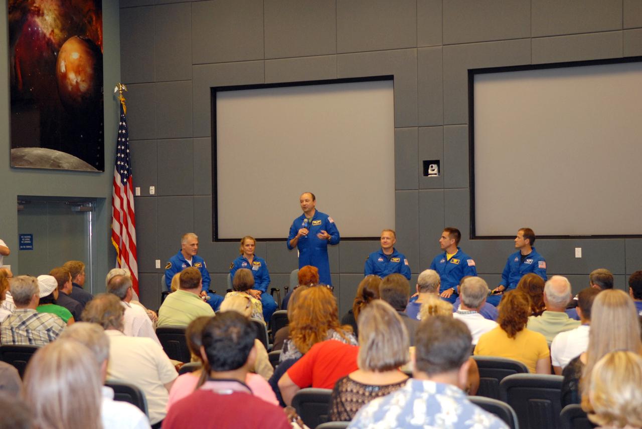 CAPE CANAVERAL, Fla. – Crew members of the STS-127 mission return to NASA's Kennedy Space Center in Florida to share stories, photos and videos of their experiences on the mission.  Seated from left are Mission Specialists Dave Wolf and Julie Payette, Commander Mark Polansky (standing), Pilot Doug Hurley, and Mission Specialists Christopher Cassidy and Tom Marshburn. The STS-127 mission was the final of three flights dedicated to the assembly of the Japanese Kibo laboratory complex on the International Space Station.  The crew launched on space shuttle Endeavour on July 15 and returned July 31.  Photo credit: NASA/Jim Grossmann