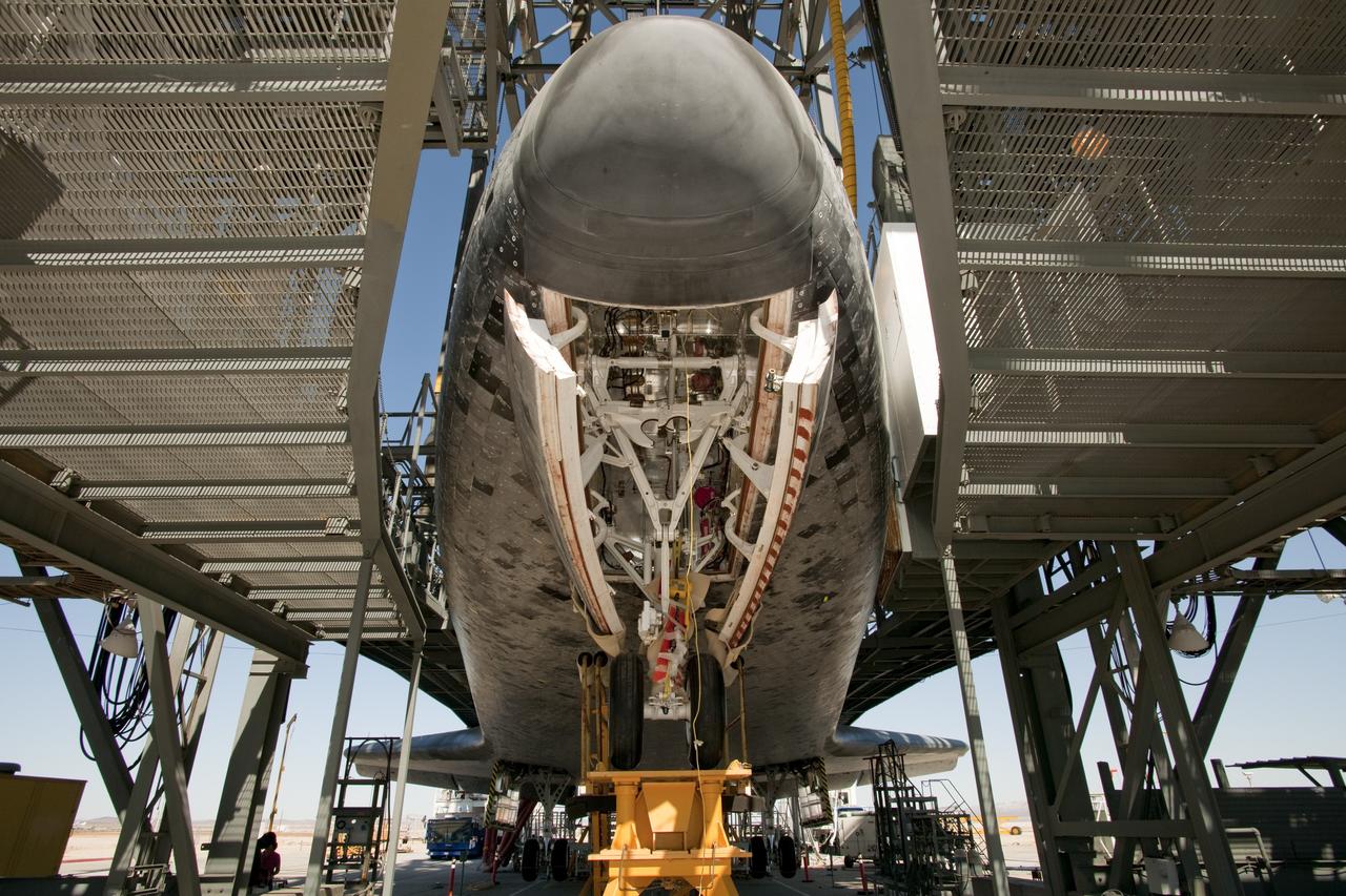 EDWARDS AIR FORCE BASE, Calif. – (ED09-0253-75) Space shuttle Discovery, mounted on leveling jacks, is surrounded by work platforms while undergoing servicing and preparations at NASA’s Dryden Flight Research Center for its ferry flight to NASA’s Kennedy Space Center in Florida. (NASA photo / Tony Landis)