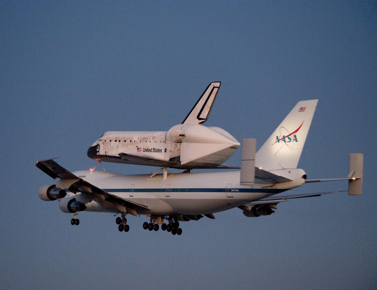 EDWARDS AIR FORCE BASE, Calif. – ED09-0253-109) NASA’s modified 747 Shuttle Carrier Aircraft with the shuttle Discovery securely mounted on top soars into the morning sky after takeoff from Edwards Air Force Base Sept. 20, 2009. The piggyback pair was due to arrive back at NASA’s Kennedy Space Center in Florida the following day after the 2,500-mile cross-country ferry flight. Discovery had landed at Edwards Sept. 11 after the STS-128 mission to the International Space Station. The shuttle delivered more than 7 tons of supplies, science racks and equipment, as well as additional environmental hardware to sustain six crew members on the International Space Station. NASA photo /Tony Landis
