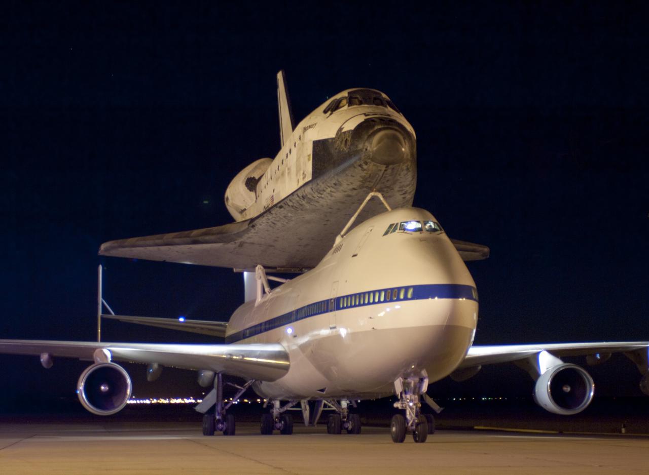 EDWARDS AIR FORCE BASE, Calif. – (ED09-0253-114)  NASA’s modified Boeing 747 carrying the space shuttle Discovery taxis toward the runway at Edwards Air Force Base in Southern California shortly before dawn on Sept. 20, 2009 prior to taking off on their two-day ferry flight to the Kennedy Space Center in Florida. Discovery had landed at Edwards Sept. 11 after the almost 14-day mission STS-128 to the International Space Station. The shuttle delivered more than 7 tons of supplies, science racks and equipment, as well as additional environmental hardware to sustain six crew members on the International Space Station.  NASA photo /Jim Ross