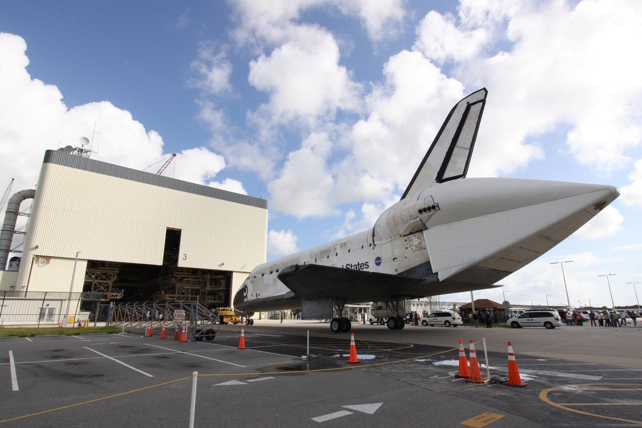 CAPE CANAVERAL, Fla. – Space shuttle Discovery is towed toward the open doors of NASA Kennedy Space Center's Orbiter Processing Facility 3. In the OPF, turnaround processing procedures on Discovery will include various post-flight deservicing and maintenance functions, which are carried out in parallel with payload removal and the installation of equipment needed for the next mission. Discovery returned to Kennedy atop a Shuttle Carrier Aircraft Sept. 21 after a two-day ferry flight. The piggybacked shuttle and aircraft touched down on the Shuttle Landing Facility's runway 33 at 12:05 p.m. EDT and the shuttle later was demated from the aircraft. Discovery landed at Edwards Air Force Base in California on Sept. 11 after the 13-day STS-128 mission to the International Space Station. Landings at Kennedy were waved off on two days due to inclement weather, leading to the landing at Edwards. Photo credit: NASA/Jack Pfaller