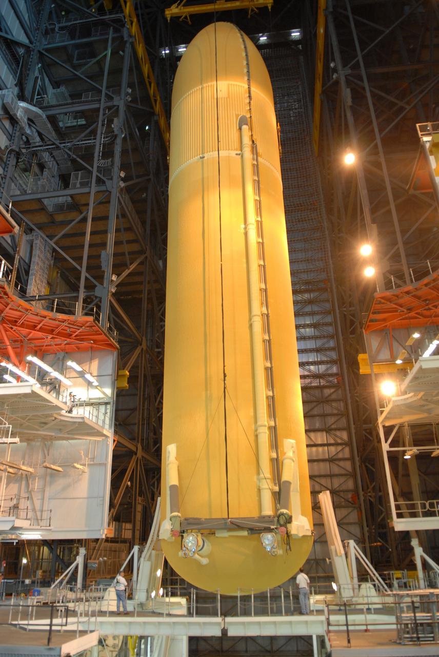 CAPE CANAVERAL, Fla. – The external fuel tank for space shuttle Atlantis' STS-129 mission is being lowered into NASA Kennedy Space Center's Vehicle Assembly Building high bay 2 for assembly with the solid rocket boosters already stacked on the mobile launch platform. The STS-129 mission is targeted to launch Nov. 12 on an 11-day supply mission to the International Space Station. Photo credit: NASA/Jim Grossmann