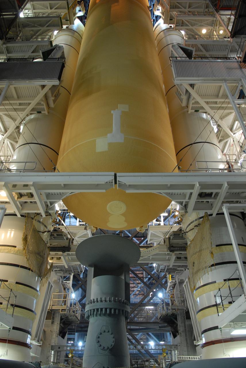 CAPE CANAVERAL, Fla. – The external fuel tank for space shuttle Atlantis' STS-129 mission is lowered between the solid rocket boosters stacked on the mobile launch platform in high bay 2 of NASA's Kennedy Space Center in Florida. The STS-129 mission is targeted to launch Nov. 12 on an 11-day supply mission to the International Space Station. Photo credit: NASA/Jim Grossmann