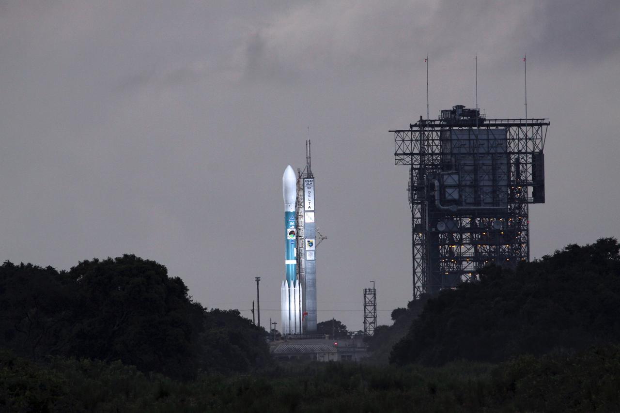 CAPE CANAVERAL, Fla. – On Launch Pad 17-B at Cape Canaveral Air Force Station in Florida, the Space Tracking and Surveillance System - Demonstrator spacecraft is bathed in light under a dark, cloudy sky. Rain over Central Florida's east coast caused the scrub of the launch.  STSS Demo is a space-based sensor component of a layered Ballistic Missile Defense System designed for the overall mission of detection, tracking and discriminating ballistic missiles.  STSS is capable of tracking objects after boost phase and provides trajectory information to other sensors. It will be launched by NASA for the Missile Defense Agency between 8 and 8:58 a.m. EDT Sept. 24. Photo credit: NASA/Jack Pfaller