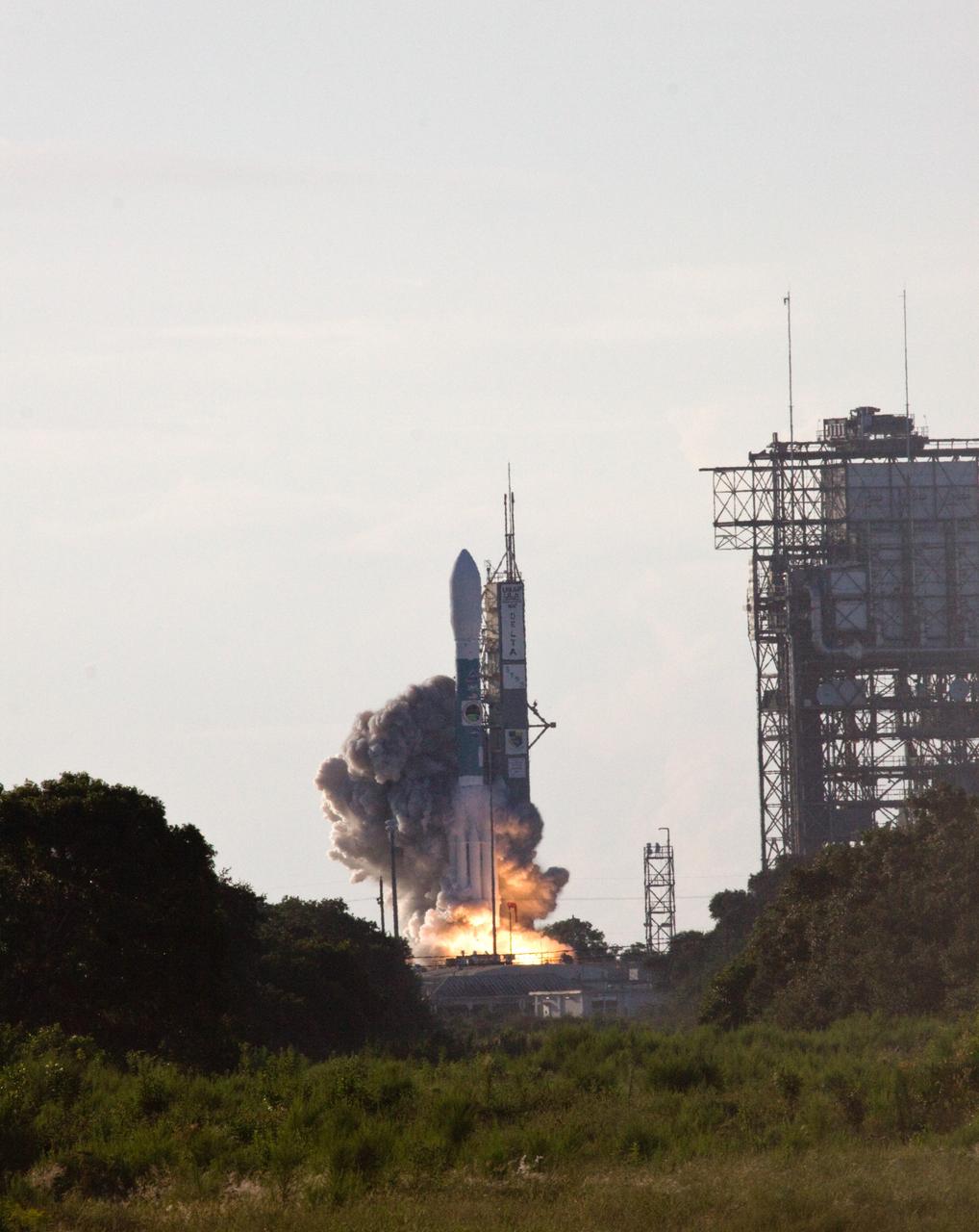 CAPE CANAVERAL, Fla. – Under a cloud-streaked sky, the Space Tracking and Surveillance System – Demonstrator, or STSS-Demo, waits through the countdown to liftoff Launch Pad 17-B at Cape Canaveral Air Force Station aboard a United Launch Alliance Delta II rocket.  STSS-Demo is being launched by NASA for the U.S. Missile Defense Agency.  Liftoff was at 8:20:22 a.m. EDT.  The STSS-Demo is a space-based sensor component of a layered Ballistic Missile Defense System designed for the overall mission of detecting, tracking and discriminating ballistic missiles. STSS is capable of tracking objects after boost phase and provides trajectory information to other sensors. Photo credit: NASA/Jack Pfaller