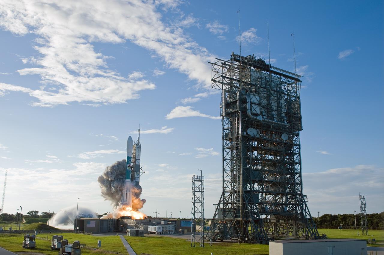 CAPE CANAVERAL, Fla. – Water at left is seen flooding Launch Pad 17-B at Cape Canaveral Air Force Station as the United Launch Alliance Delta II rocket carrying the Space Tracking and Surveillance System - Demonstrator, or STSS-Demo, spacecraft lifts off.  STSS-Demo was launched at 8:20:22 a.m. EDT by NASA for the U.S. Missile Defense Agency.  The STSS-Demo is a space-based sensor component of a layered Ballistic Missile Defense System designed for the overall mission of detecting, tracking and discriminating ballistic missiles. STSS is capable of tracking objects after boost phase and provides trajectory information to other sensors. Photo credit: NASA/Sandra Joseph- Kevin O'Connell