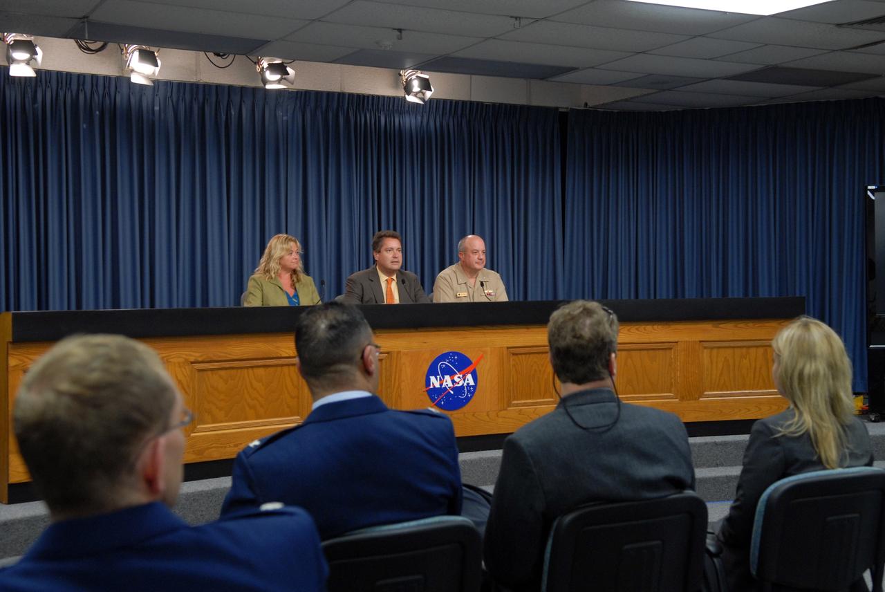 CAPE CANAVERAL, Fla. –  Public Affairs Officer Tracy Young moderates a post-launch news conference for the media about the Space Tracking and Satellite System – Demonstrator spacecraft.   Seated at center is Omar Baez, NASA launch manager, and Rear Adm. Joseph Horn, deputy director, with the U.S. Missile Defense Agency.  The STSS-Demo is a space-based sensor component of a layered Ballistic Missile Defense System designed for the overall mission of detecting, tracking and discriminating ballistic missiles.  The spacecraft was launched by NASA for the U.S. Missile Defense Agency. Photo credit: NASA/Jim Grossmann