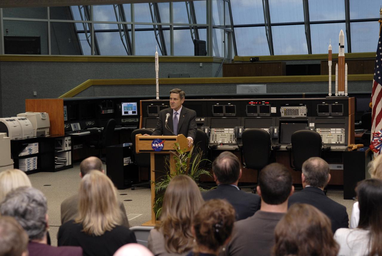 CAPE CANAVERAL, Fla. –  NASA Kennedy Space Center Director Bob Cabana welcomes guests to the ceremony that officially turns over the Launch Control Center's Firing Room 1 from the Space Shuttle Program to the Constellation Program at Kennedy.   The room has undergone demolition and construction and been outfitted with consoles for the upcoming Ares I-X rocket flight test targeted for launch on Oct. 27. As the center of launch operations at Kennedy since the Apollo Program, the Launch Control Center, or LCC, has played a central role in NASA's human spaceflight programs. Firing Room 1 was the first operational firing room constructed. From this room, controllers launched the first Saturn V, the first crewed flight of Saturn V, the first crewed mission to the moon and the first space shuttle. Firing Room 1 will continue this tradition of firsts when controllers launch the Constellation Program's first flight test. Also, this firing room will be the center of operations for the upcoming Ares I and Orion operations. Photo credit: NASA/Kim Shiflett