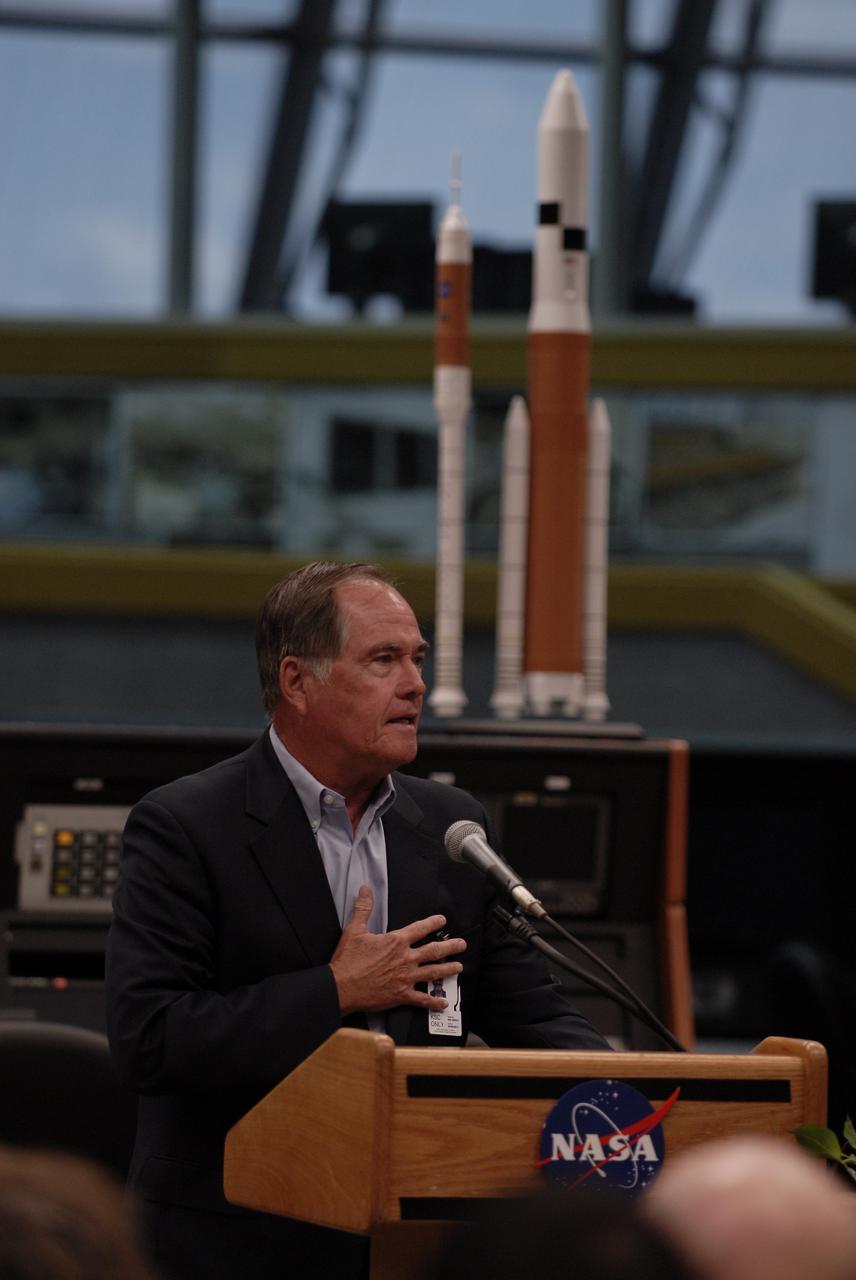 CAPE CANAVERAL, Fla. –  During a ceremony that officially turns over NASA Kennedy Space Center's Launch Control Center Firing Room 1 from the Space Shuttle Program to the Constellation Program, former astronaut Robert Crippen shares personal experiences. The room has undergone demolition and construction and been outfitted with consoles for the upcoming Ares I-X rocket flight test targeted for launch on Oct. 27. As the center of launch operations at Kennedy since the Apollo Program, the Launch Control Center, or LCC, has played a central role in NASA's human spaceflight programs. Firing Room 1 was the first operational firing room constructed. From this room, controllers launched the first Saturn V, the first crewed flight of Saturn V, the first crewed mission to the moon and the first space shuttle. Firing Room 1 will continue this tradition of firsts when controllers launch the Constellation Program's first flight test. Also, this firing room will be the center of operations for the upcoming Ares I and Orion operations. Photo credit: NASA/Kim Shiflett