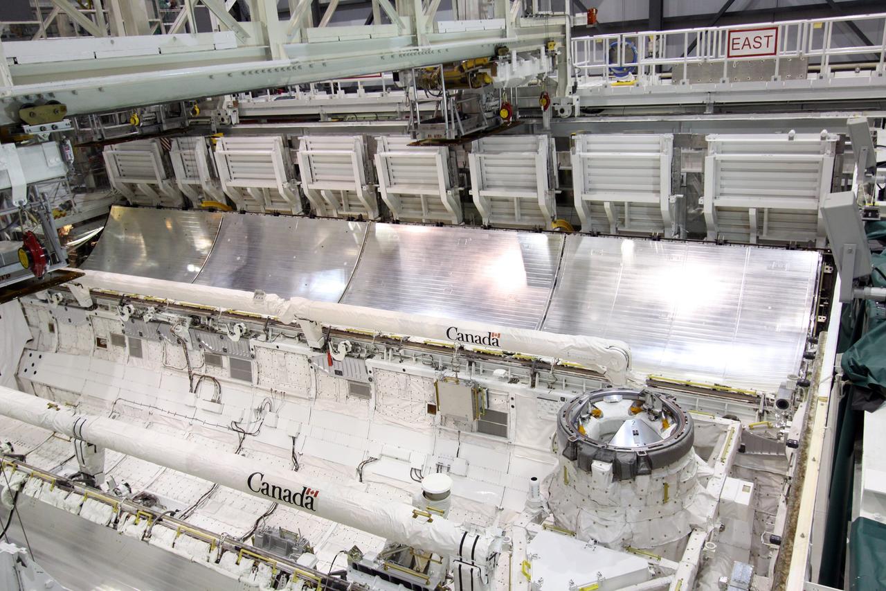 CAPE CANAVERAL, Fla. –  In Orbiter Processing Facility 1 at NASA's Kennedy Space Center in Florida, the payload bay doors are being closed on space shuttle Atlantis.  The designated shuttle for the STS-129 mission, Atlantis will deliver to the International Space Station two spare gyroscopes, two nitrogen tank assemblies, two pump modules, an ammonia tank assembly and a spare latching end effector for the station's robotic arm. Atlantis is targeted to launch Nov. 12. Photo credit: NASA/Jack Pfaller