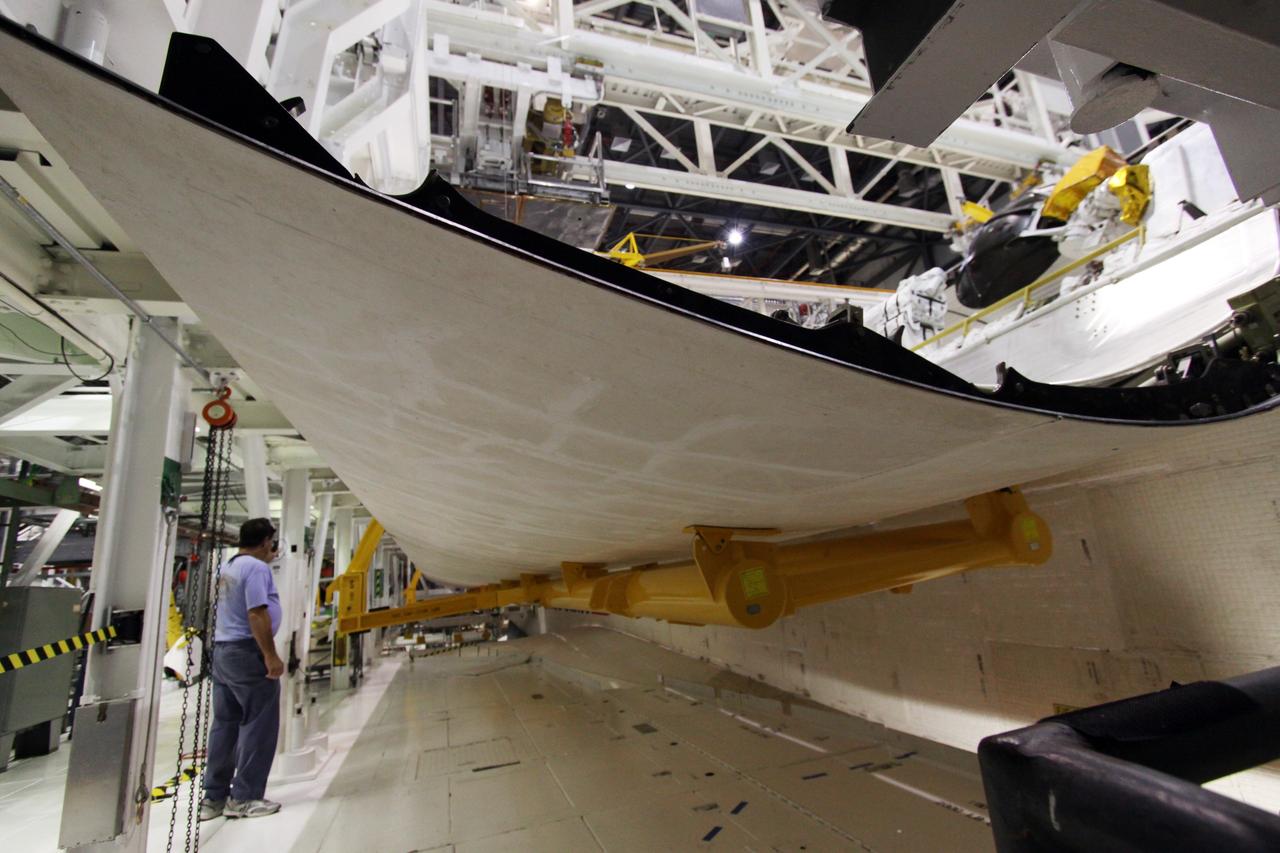 CAPE CANAVERAL, Fla. –  In Orbiter Processing Facility 1 at NASA's Kennedy Space Center in Florida,  space shuttle Atlantis' payload bay door is closing.  The designated shuttle for the STS-129 mission, Atlantis will deliver to the International Space Station two spare gyroscopes, two nitrogen tank assemblies, two pump modules, an ammonia tank assembly and a spare latching end effector for the station's robotic arm. Atlantis is targeted to launch Nov. 12. Photo credit: NASA/Jack Pfaller