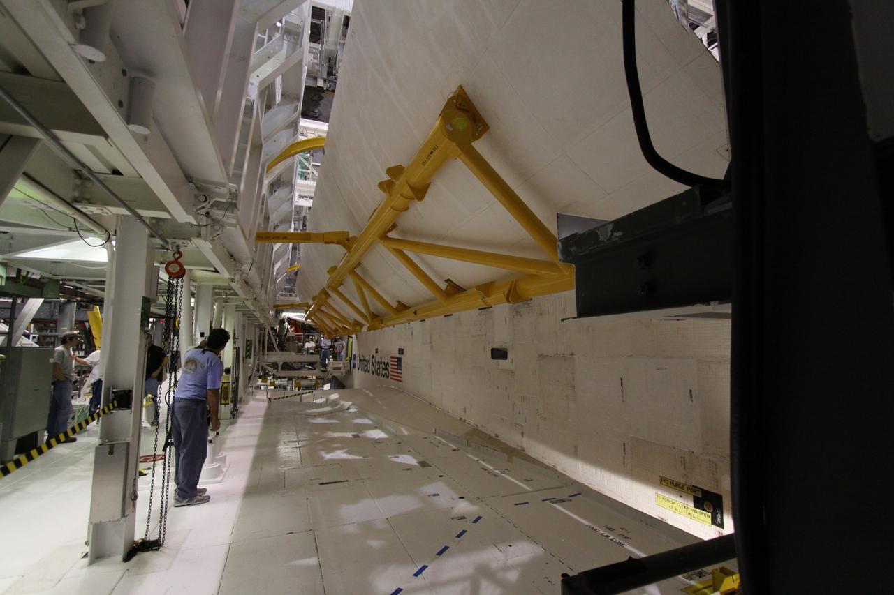 CAPE CANAVERAL, Fla. –  In Orbiter Processing Facility 1 at NASA's Kennedy Space Center in Florida,  space shuttle Atlantis' payload bay door is closing.  The designated shuttle for the STS-129 mission, Atlantis will deliver to the International Space Station two spare gyroscopes, two nitrogen tank assemblies, two pump modules, an ammonia tank assembly and a spare latching end effector for the station's robotic arm. Atlantis is targeted to launch Nov. 12. Photo credit: NASA/Jack Pfaller