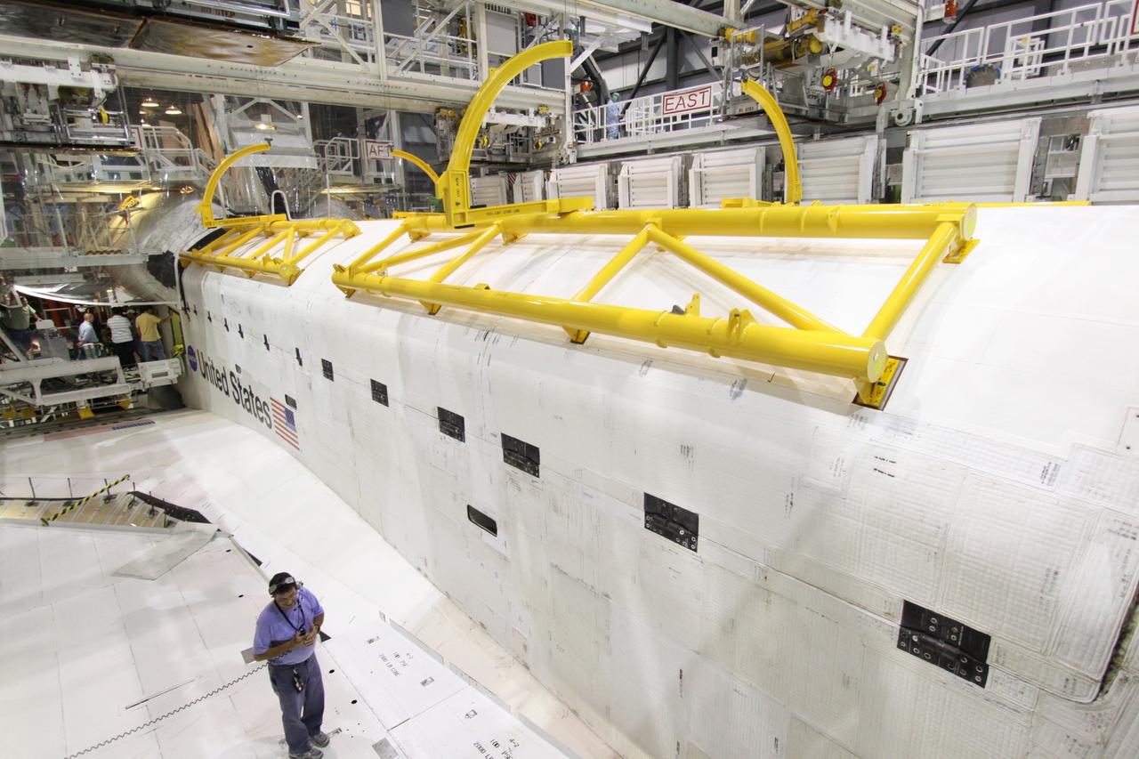 CAPE CANAVERAL, Fla. –  In Orbiter Processing Facility 1 at NASA's Kennedy Space Center in Florida,  space shuttle Atlantis' payload bay doors  are being closed. The designated shuttle for the STS-129 mission, Atlantis will deliver to the International Space Station two spare gyroscopes, two nitrogen tank assemblies, two pump modules, an ammonia tank assembly and a spare latching end effector for the station's robotic arm. Atlantis is targeted to launch Nov. 12. Photo credit: NASA/Jack Pfaller
