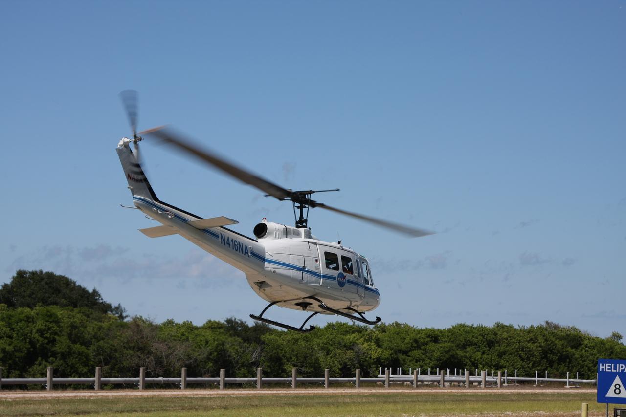 CAPE CANAVERAL, Fla. –  A NASA helicopter takes off while participating in a Mode II-IV exercise at NASA's Kennedy Space Center in Florida.  The exercise involves NASA fire rescue personnel, volunteers portraying astronauts with simulated injuries, helicopters and personnel from the Air Force’s 920th Rescue Wing and medical trauma teams at three central Florida hospitals.  The drill allows teams to practice an emergency response at Pad 39A, including helicopter evacuation to local hospitals. The Space Shuttle Program and U.S. Air Force are conducting the emergency simulation.  Photo credit: NASA/Dimitri Gerondidakis