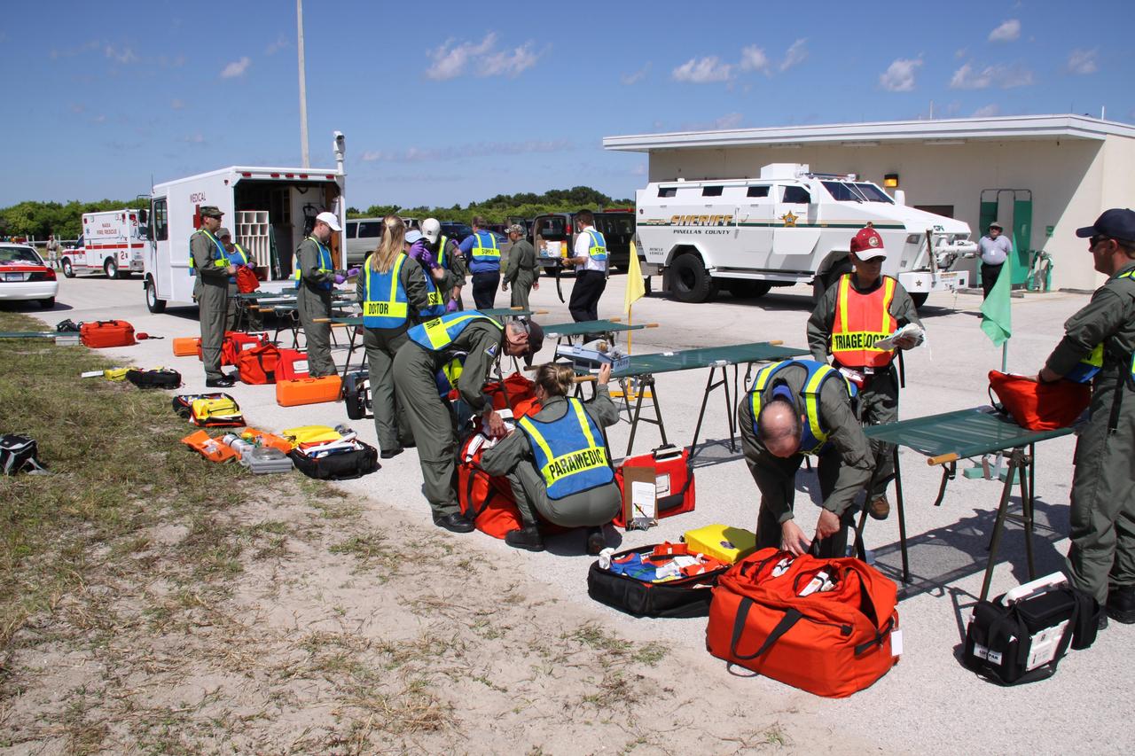 CAPE CANAVERAL, Fla. – At NASA's Kennedy Space Center in Florida, teams prepare a triage center for the Mode II-IV exercise that allows teams to practice an emergency response at Launch Pad 39A, including helicopter evacuation to local hospitals. The exercise involves NASA fire rescue personnel, volunteers portraying astronauts with simulated injuries, helicopters and personnel from the Air Force’s 920th Rescue Wing and medical trauma teams at three central Florida hospitals. The Space Shuttle Program and U.S. Air Force are conducting the emergency simulation. Photo credit: NASA/Troy Cryder
