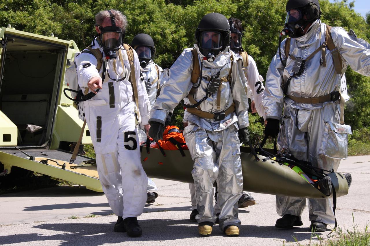 CAPE CANAVERAL, Fla. –  At NASA's Kennedy Space Center in Florida, volunteers and teams take part in a Mode II-IV exercise that allows teams to practice an emergency response at Launch Pad 39A, including helicopter evacuation to local hospitals. The exercise involves NASA fire rescue personnel, volunteers portraying astronauts with simulated injuries, helicopters and personnel from the Air Force’s 920th Rescue Wing and medical trauma teams at three central Florida hospitals. The Space Shuttle Program and U.S. Air Force are conducting the emergency simulation. Photo credit:  NASA/Troy Cryder