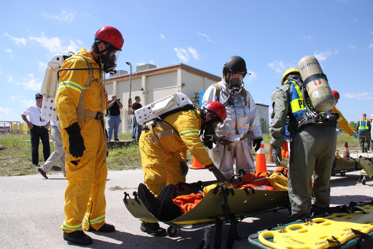CAPE CANAVERAL, Fla. – At NASA's Kennedy Space Center in Florida, volunteers and teams take part in a Mode II-IV exercise that allows teams to practice an emergency response at Launch Pad 39A, including helicopter evacuation to local hospitals.  The exercise involves NASA fire rescue personnel, volunteers portraying astronauts with simulated injuries, helicopters and personnel from the Air Force’s 920th Rescue Wing and medical trauma teams at three central Florida hospitals. The Space Shuttle Program and U.S. Air Force are conducting the emergency simulation. Photo credit:  NASA/Troy Cryder