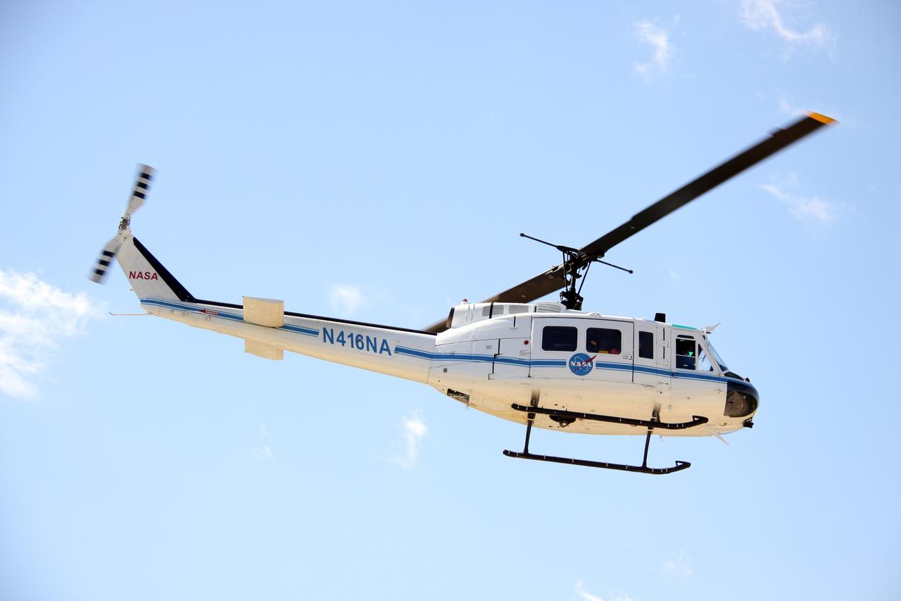 CAPE CANAVERAL, Fla. – A NASA helicopter takes off while participating in a Mode II-IV exercise at NASA's Kennedy Space Center in Florida.  The exercise allows teams to practice an emergency response at Launch Pad 39A, including helicopter evacuation to local hospitals. The exercise involves NASA fire rescue personnel, volunteers portraying astronauts with simulated injuries, helicopters and personnel from the Air Force’s 920th Rescue Wing and medical trauma teams at three central Florida hospitals. The Space Shuttle Program and U.S. Air Force are conducting the emergency simulation. Photo credit:  NASA/Troy Cryder