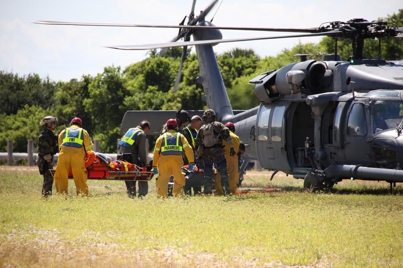 CAPE CANAVERAL, Fla. – At NASA's Kennedy Space Center in Florida, volunteers portraying astronauts are transported to helicopters as part of a Mode II-IV exercise that allows teams to practice an emergency response at Launch Pad 39A, including helicopter evacuation to local hospitals.  The exercise allows teams to practice an emergency response at Launch Pad 39A, including helicopter evacuation to local hospitals. The exercise involves NASA fire rescue personnel, volunteers portraying astronauts with simulated injuries, helicopters and personnel from the Air Force’s 920th Rescue Wing and medical trauma teams at three central Florida hospitals. The Space Shuttle Program and U.S. Air Force are conducting the emergency simulation. Photo credit:  NASA/Troy Cryder