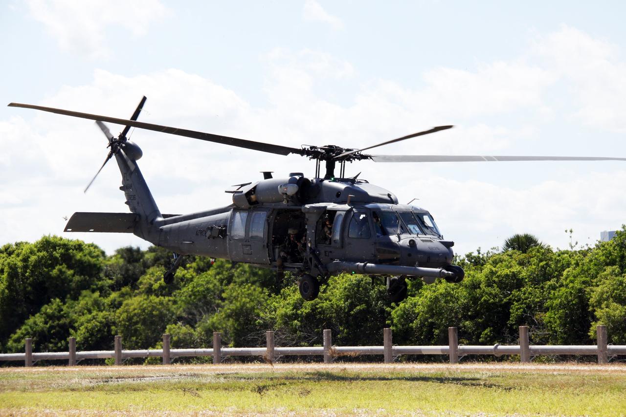 CAPE CANAVERAL, Fla. – An Air Force helicopter takes off while participating in a Mode II-IV exercise at NASA's Kennedy Space Center in Florida.  The exercise allows teams to practice an emergency response at Launch Pad 39A, including helicopter evacuation to local hospitals.  The exercise allows teams to practice an emergency response at Launch Pad 39A, including helicopter evacuation to local hospitals. The exercise involves NASA fire rescue personnel, volunteers portraying astronauts with simulated injuries, helicopters and personnel from the Air Force’s 920th Rescue Wing and medical trauma teams at three central Florida hospitals. The Space Shuttle Program and U.S. Air Force are conducting the emergency simulation. Photo credit:  NASA/Troy Cryder