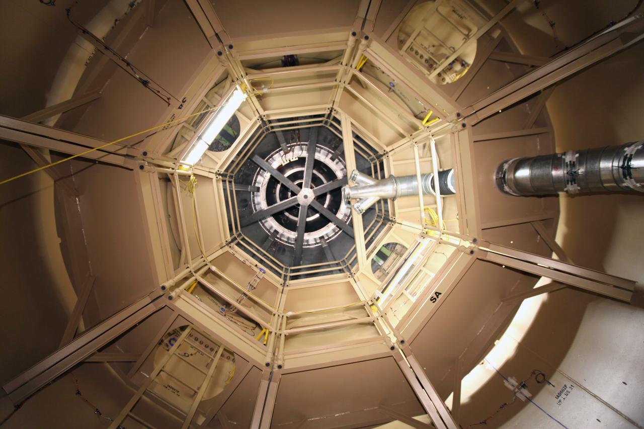 CAPE CANAVERAL, Fla. – Steep ladders mounted to opposing sides of the interior wall of the upper stage simulator of the Ares I-X rocket provide the only access inside the vehicle for the installation of instruments and equipment.     Part of the Constellation Program, the Ares I-X is the test vehicle for the Ares I, which is the essential core of a space transportation system designed to carry crewed missions back to the moon, on to Mars and out into the solar system. The Ares I-X flight test is targeted for Oct. 27. For information on the Ares I-X vehicle and flight test, visit http://www.nasa.gov/mission_pages/constellation/ares/flighttests/aresIx/index.html. Photo credit: NASA/Glenn Benson