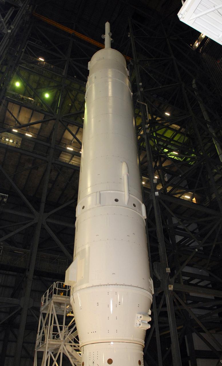 CAPE CANAVERAL, Fla. – Processing of the Ares I-X vehicle nears completion in the Vehicle Assembly Building's High Bay 3 at NASA's Kennedy Space Center in Florida. Rollout to Launch Pad 39B is targeted for Oct. 19.    Part of the Constellation Program, the Ares I-X is the test vehicle for the Ares I, which is the essential core of a space transportation system designed to carry crewed missions back to the moon, on to Mars and out into the solar system. The Ares I-X flight test is targeted for Oct. 27. For information on the Ares I-X vehicle and flight test, visit http://www.nasa.gov/mission_pages/constellation/ares/flighttests/aresIx/index.html. Photo credit: NASA/Jim Grossmann