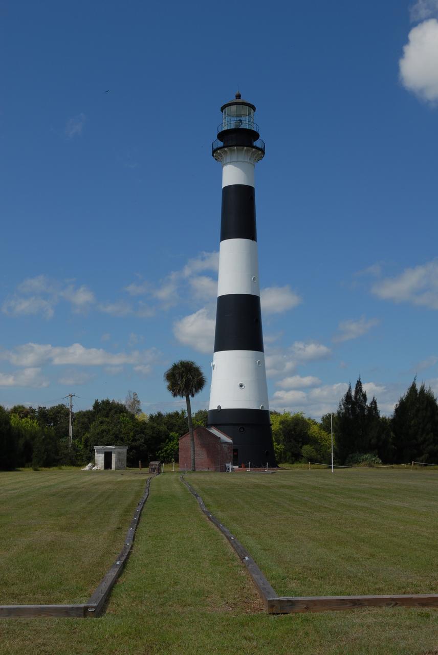 CAPE CANAVERAL, Fla. – The Cape Canaveral Lighthouse stands in the midst of space-age structures, a monolith born in another era of exploration. Located near Launch Complex 36 on Cape Canaveral Air Force Station, the Coast Guard transferred ownership in 2000 of the lighthouse structure and its grounds to the U.S. Air Force, which is now responsible for maintaining it. A restoration of the lighthouse was completed by the Air Force in 2007. The Coast Guard continues to maintain the beacon as an active navigational aid. For the history of the lighthouse, visit http://www.nasa.gov/centers/kennedy/about/history/lighthouse.html. For current information, visit http://www.CanaveralLight.org. Photo credit: NASA/Jim Grossmann