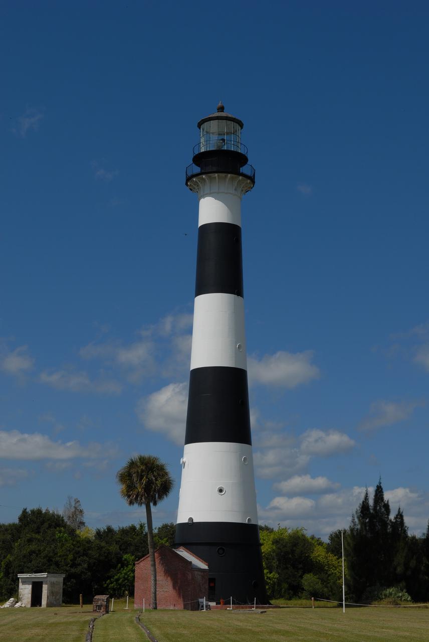 CAPE CANAVERAL, Fla. – The Cape Canaveral Lighthouse stands in the midst of space-age structures, a monolith born in another era of exploration. Located near Launch Complex 36 on Cape Canaveral Air Force Station, the Coast Guard transferred ownership in 2000 of the lighthouse structure and its grounds to the U.S. Air Force, which is now responsible for maintaining it. A restoration of the lighthouse was completed by the Air Force in 2007. The Coast Guard continues to maintain the beacon as an active navigational aid. For the history of the lighthouse, visit http://www.nasa.gov/centers/kennedy/about/history/lighthouse.html. For current information, visit http://www.CanaveralLight.org. Photo credit: NASA/Jim Grossmann