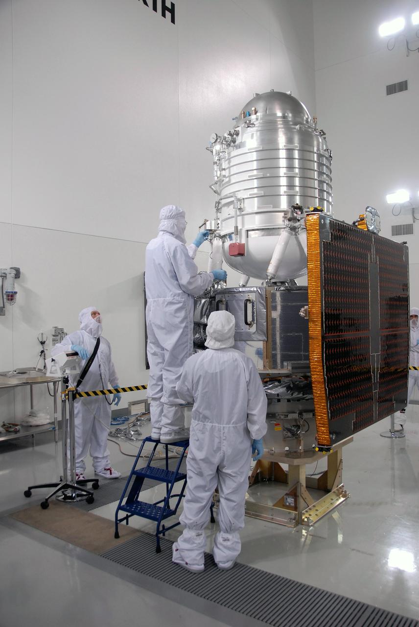 VANDENBERG AIR FORCE BASE, Calif. -- At the Astrotech processing facility on Vandenberg Air Force Base in California, workers prepare NASA's Wide-field Infrared Survey Explorer, or WISE, to be lifted from its test stand to determine its exact weight.    The satellite will survey the entire sky at infrared wavelengths, creating a cosmic clearinghouse of hundreds of millions of objects which will be catalogued and provide a vast storehouse of knowledge about the solar system, the Milky Way, and the universe. Launch is scheduled for Dec. 7.  Photo credit: NASA/Doug Kolkow