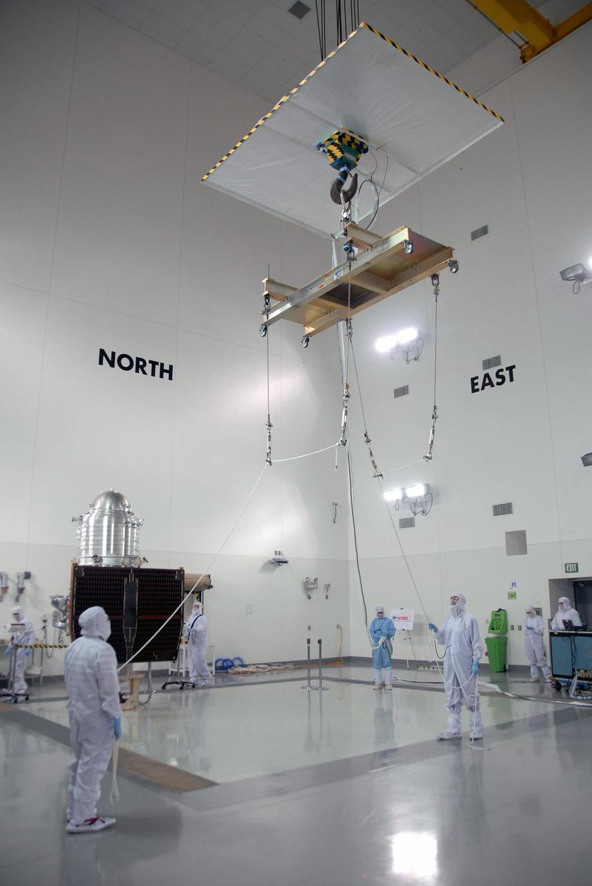 VANDENBERG AIR FORCE BASE, Calif. -- At the Astrotech processing facility on Vandenberg Air Force Base in California, a crane is moved into position to lift NASA's Wide-field Infrared Survey Explorer, or WISE, from its test stand to determine its exact weight.    The satellite will survey the entire sky at infrared wavelengths, creating a cosmic clearinghouse of hundreds of millions of objects which will be catalogued and provide a vast storehouse of knowledge about the solar system, the Milky Way, and the universe. Launch is scheduled for Dec. 7.  Photo credit: NASA/Doug Kolkow